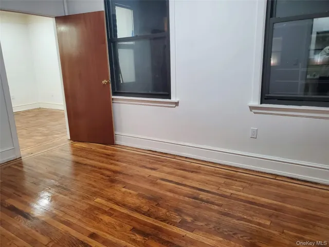 a view of a room with wooden floor and staircase