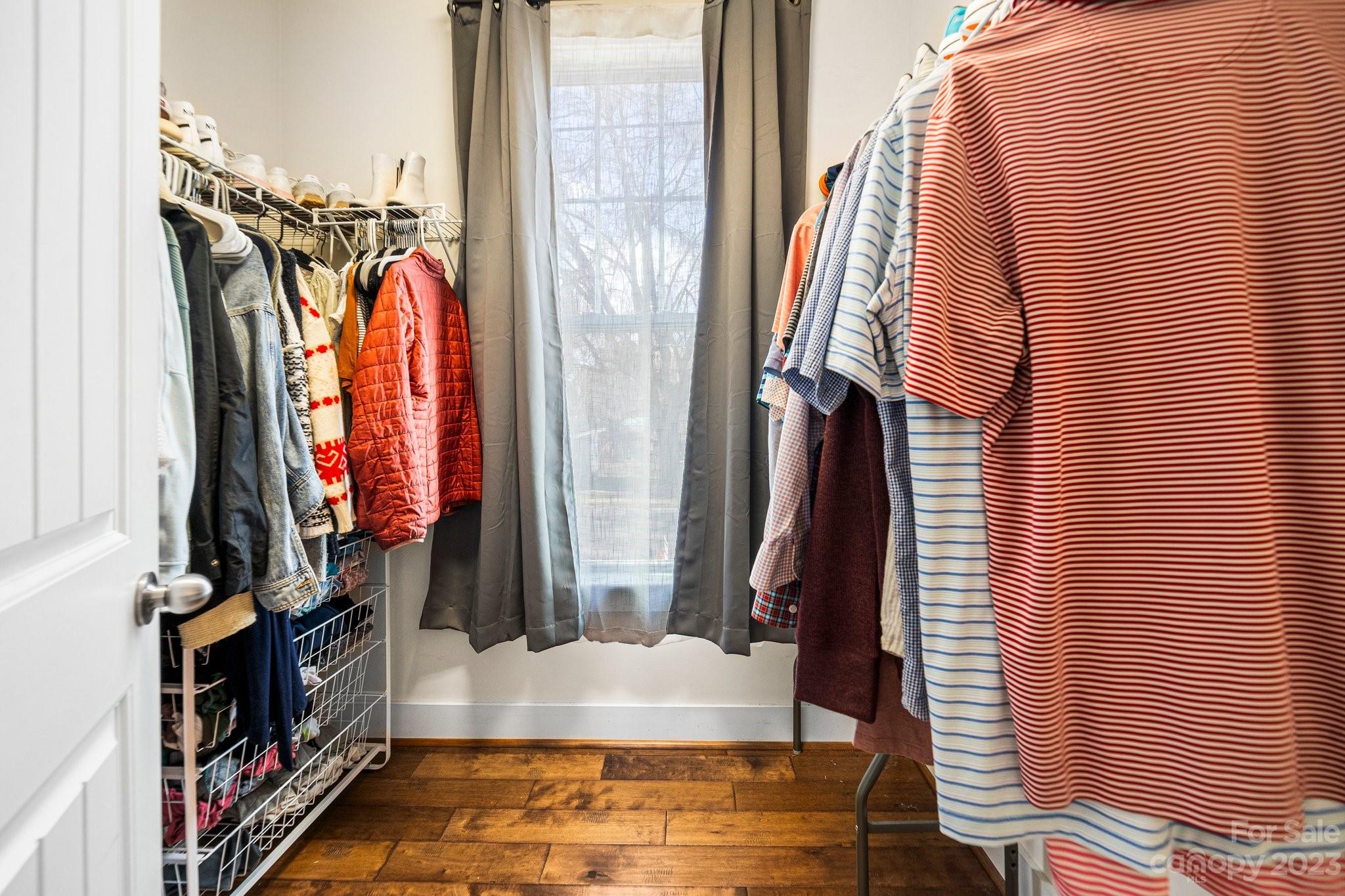 152 Mock Road Davidson, NC 28036 - Photo 16 of 29 a view of walk in closet with clothes and shoes