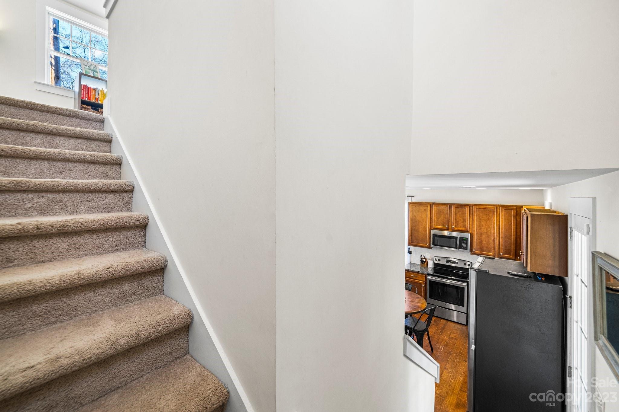 152 Mock Road Davidson, NC 28036 - Photo 19 of 29 a view of entryway and hall with wooden floor