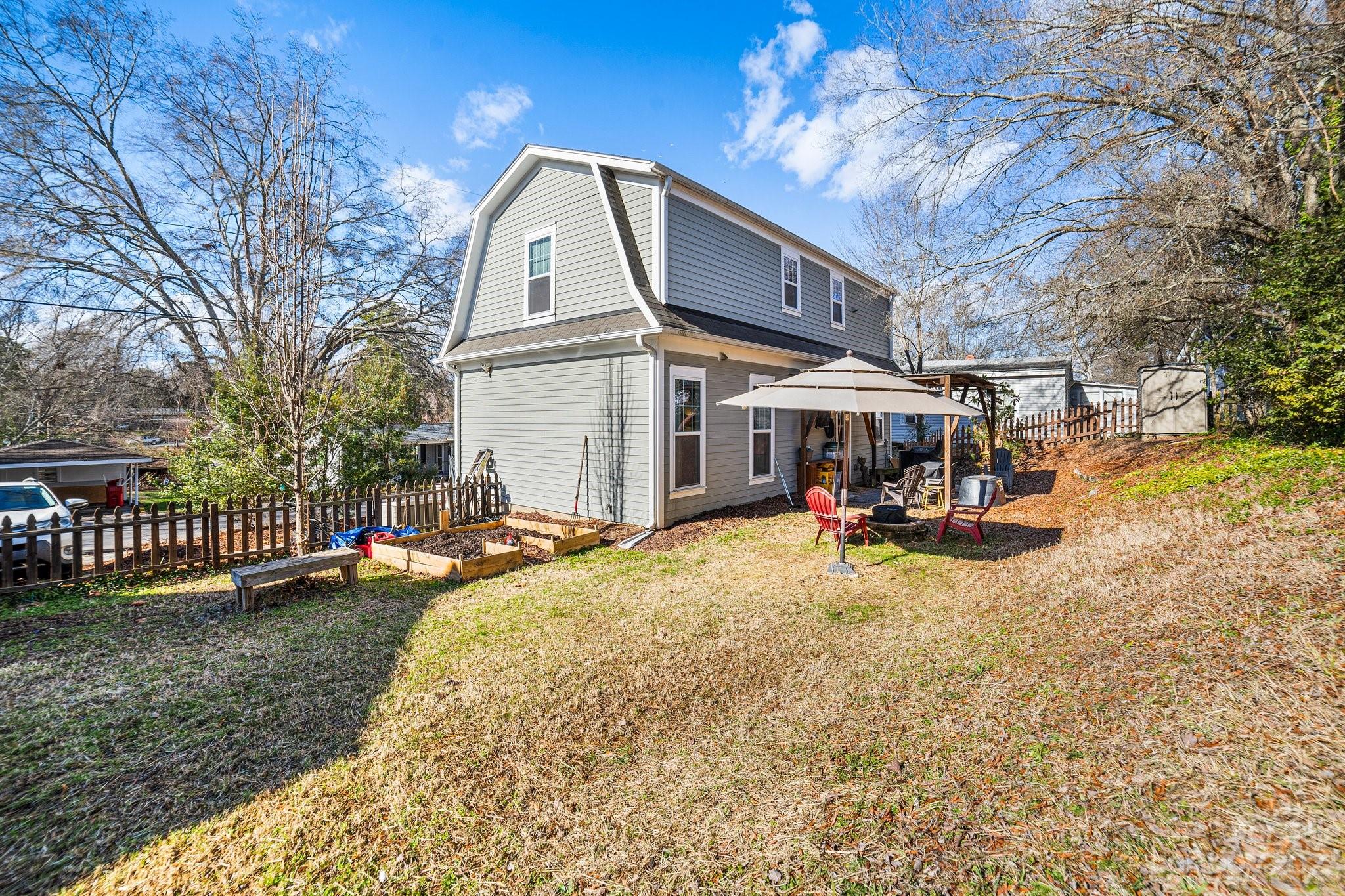 152 Mock Road Davidson, NC 28036 - Photo 29 of 29 a view of a house with backyard porch and sitting area