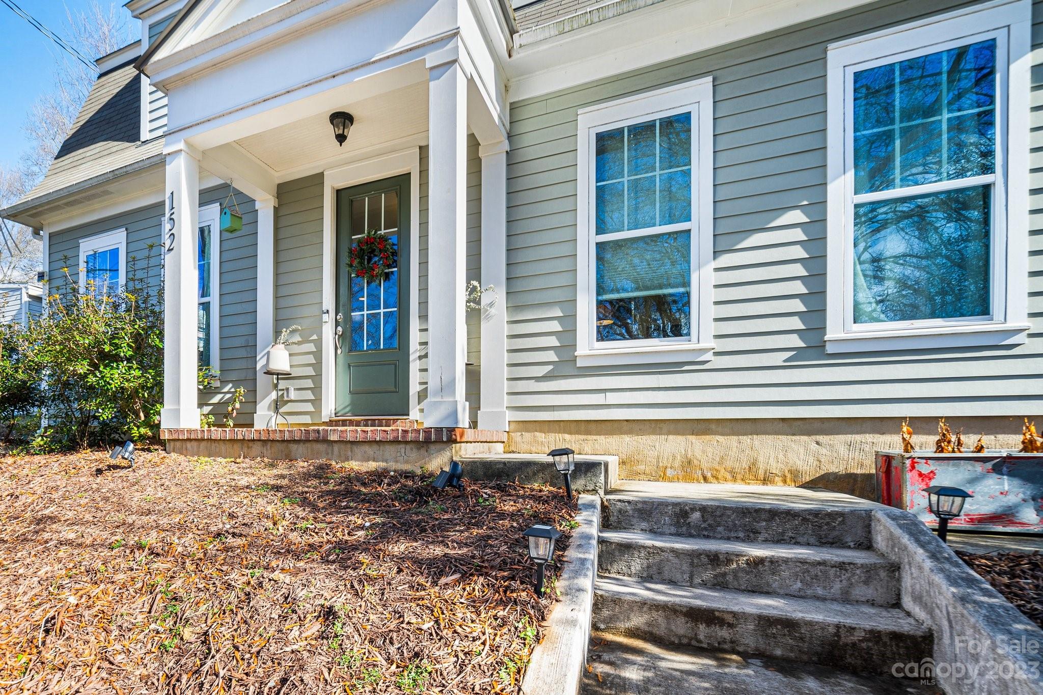 152 Mock Road Davidson, NC 28036 - Photo 4 of 29 a front view of a house with a yard