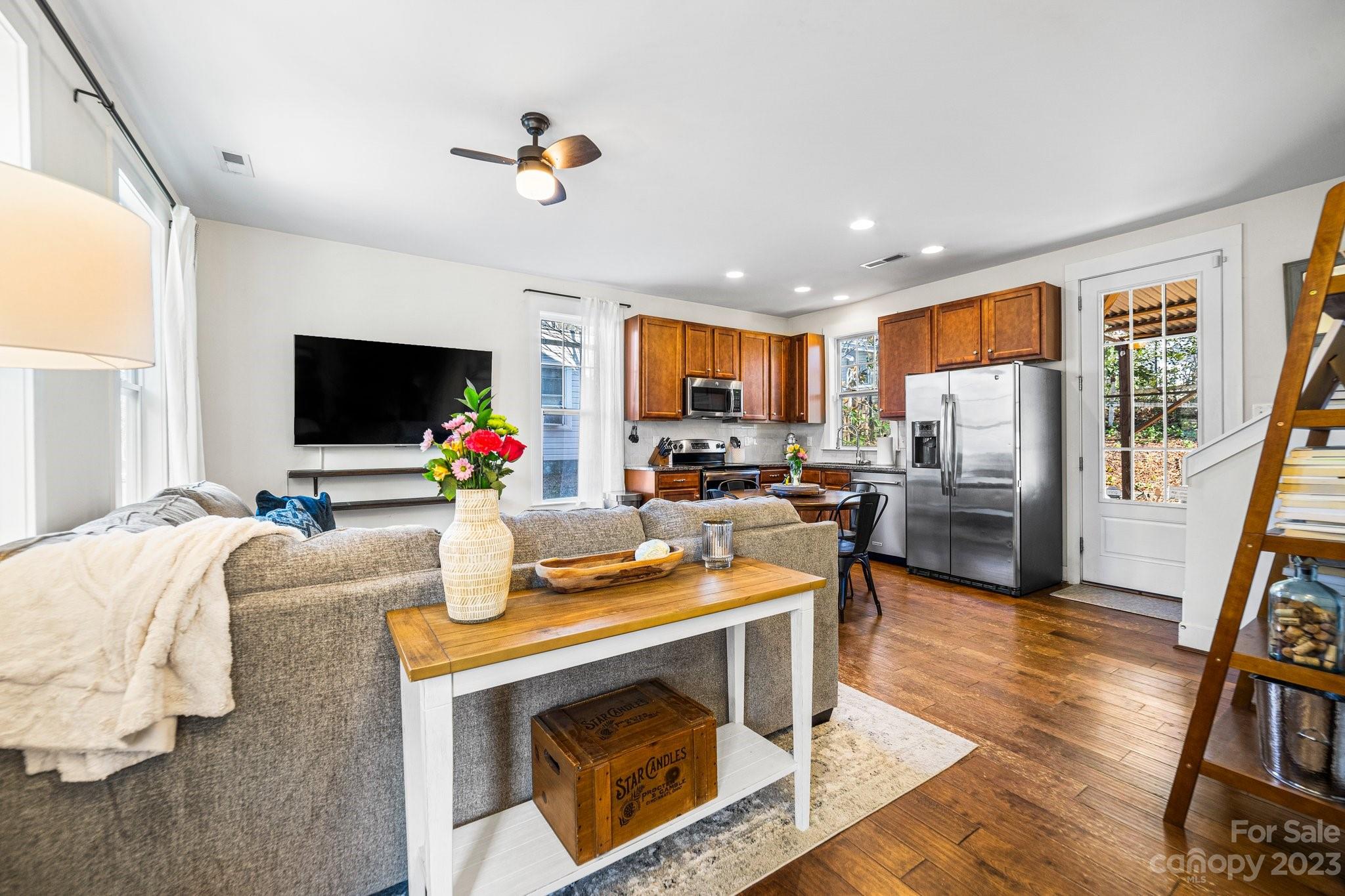 152 Mock Road Davidson, NC 28036 - Photo 6 of 29 a living room with fireplace furniture and a flat screen tv