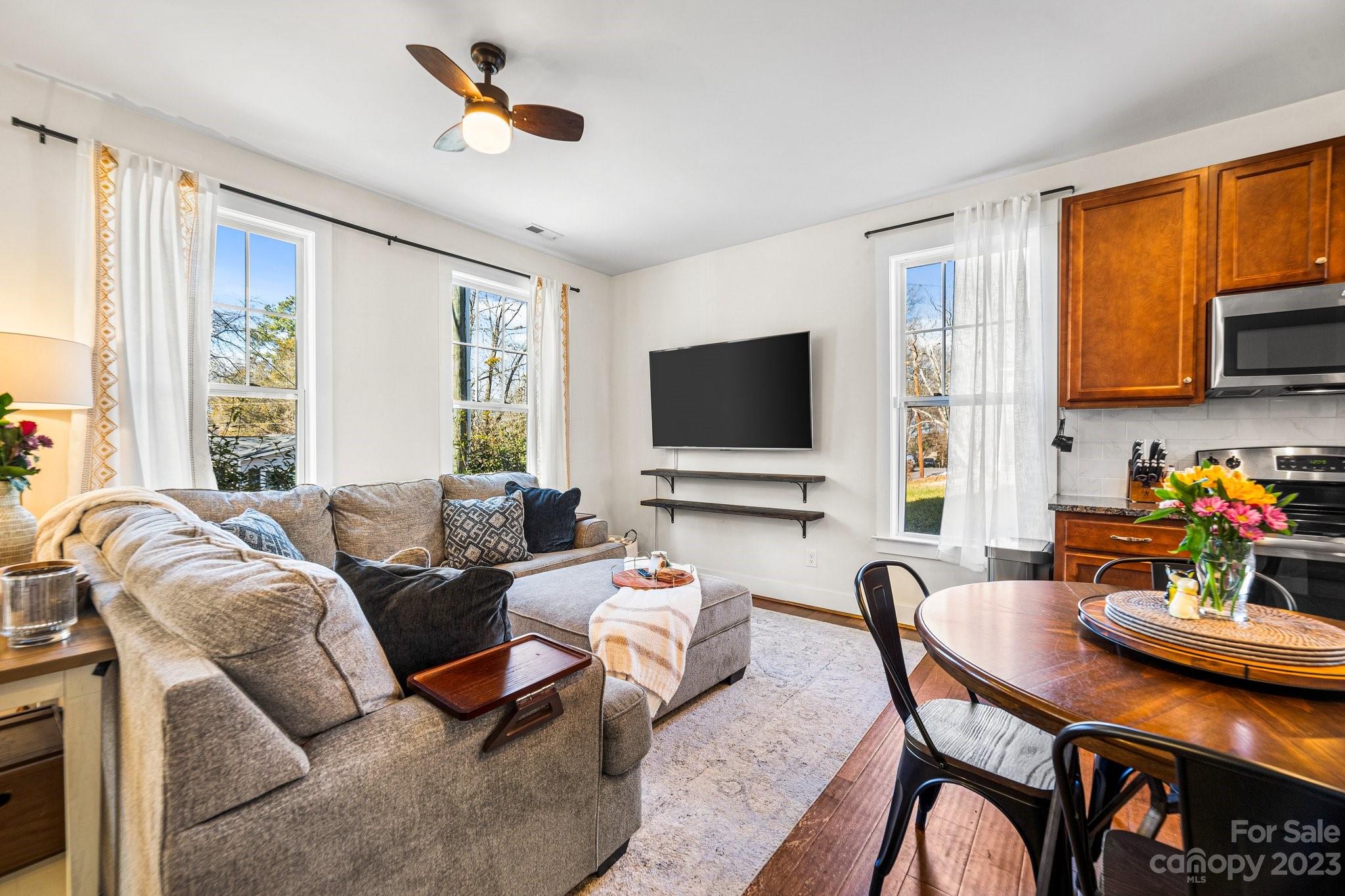 152 Mock Road Davidson, NC 28036 - Photo 8 of 29 a living room with furniture and a flat screen tv
