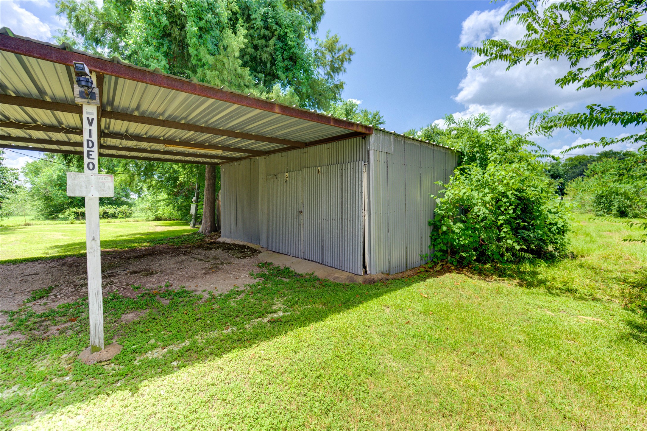 3330 Euell Road Crosby, TX 77532 - Photo 5 of 9 a view of a backyard with plants and a large tree