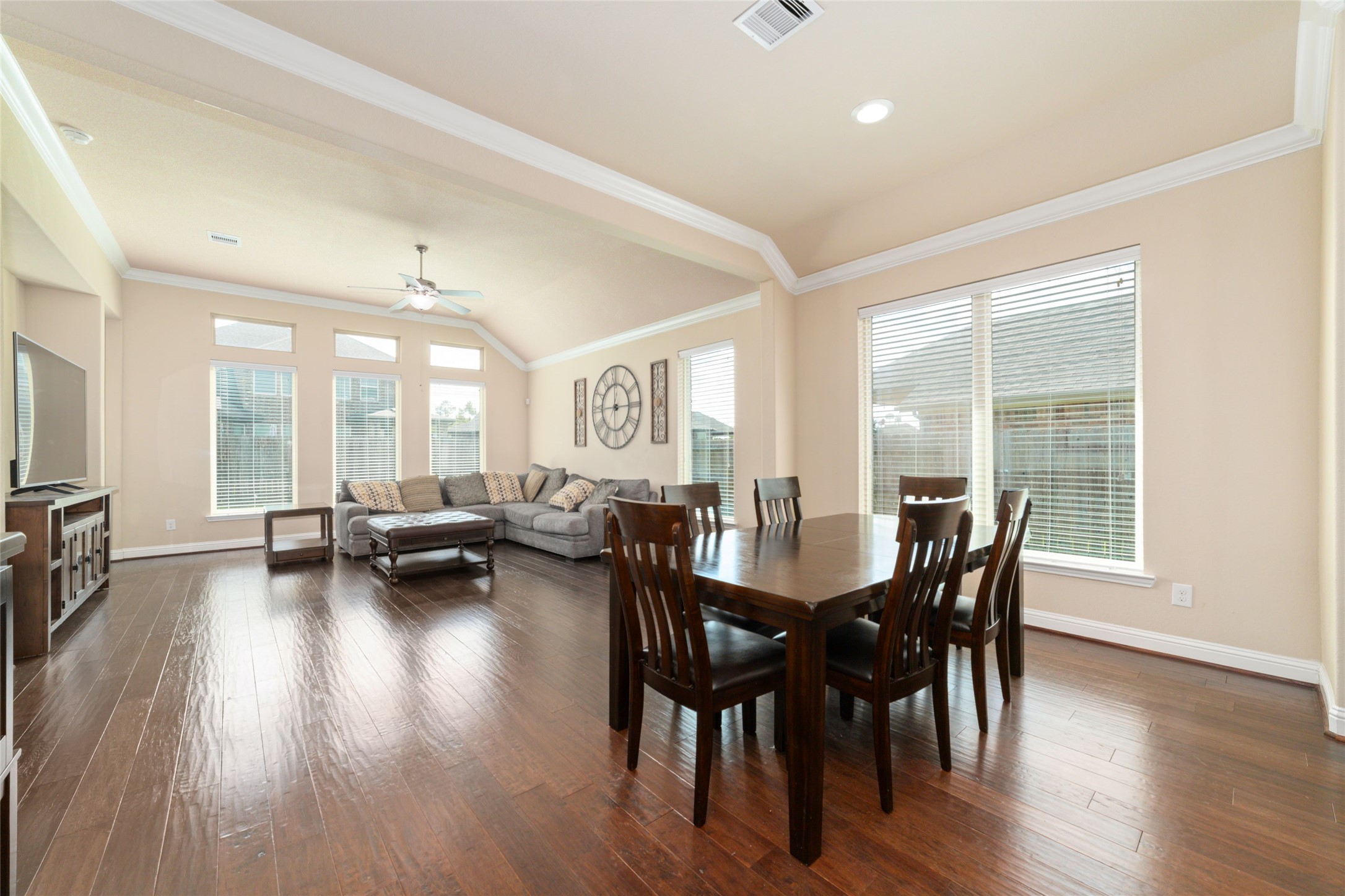 a view of a dining room with furniture and wooden floor