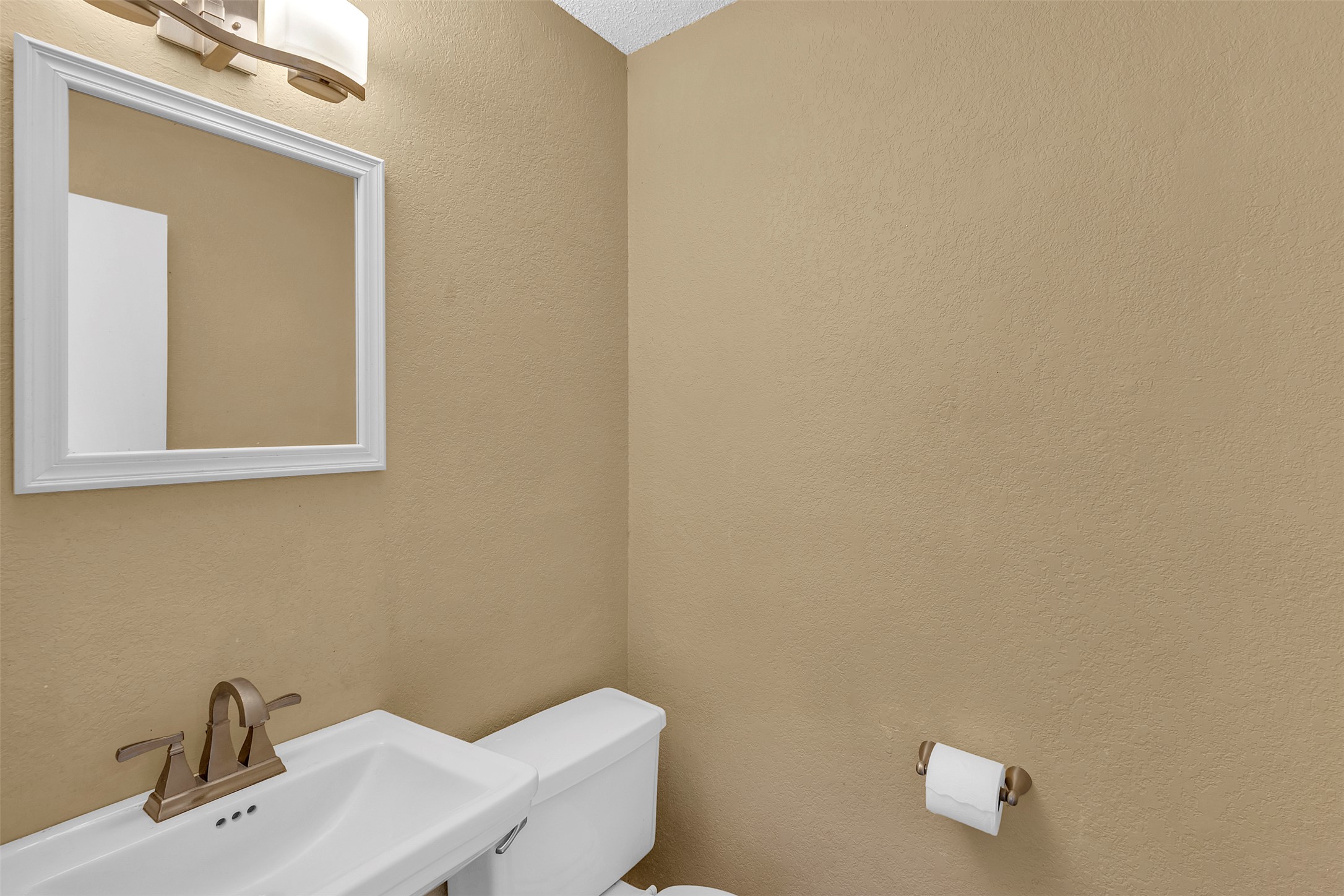 12922 Marimba Trail Austin, TX 78729 - Photo 3 of 28 Half bath featuring toilet and a textured wall
