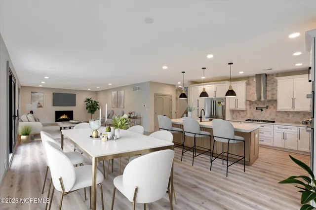a kitchen with stainless steel appliances a sink and cabinets