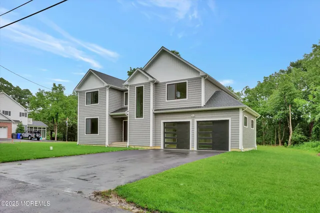 a view of green field with trees in the background