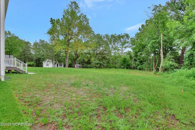 a view of an entryway with wooden floor and door