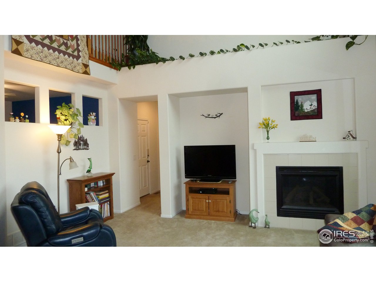 8121 Raspberry Drive Frederick, CO 80504 - Photo 11 of 38 a living room with furniture and a fireplace