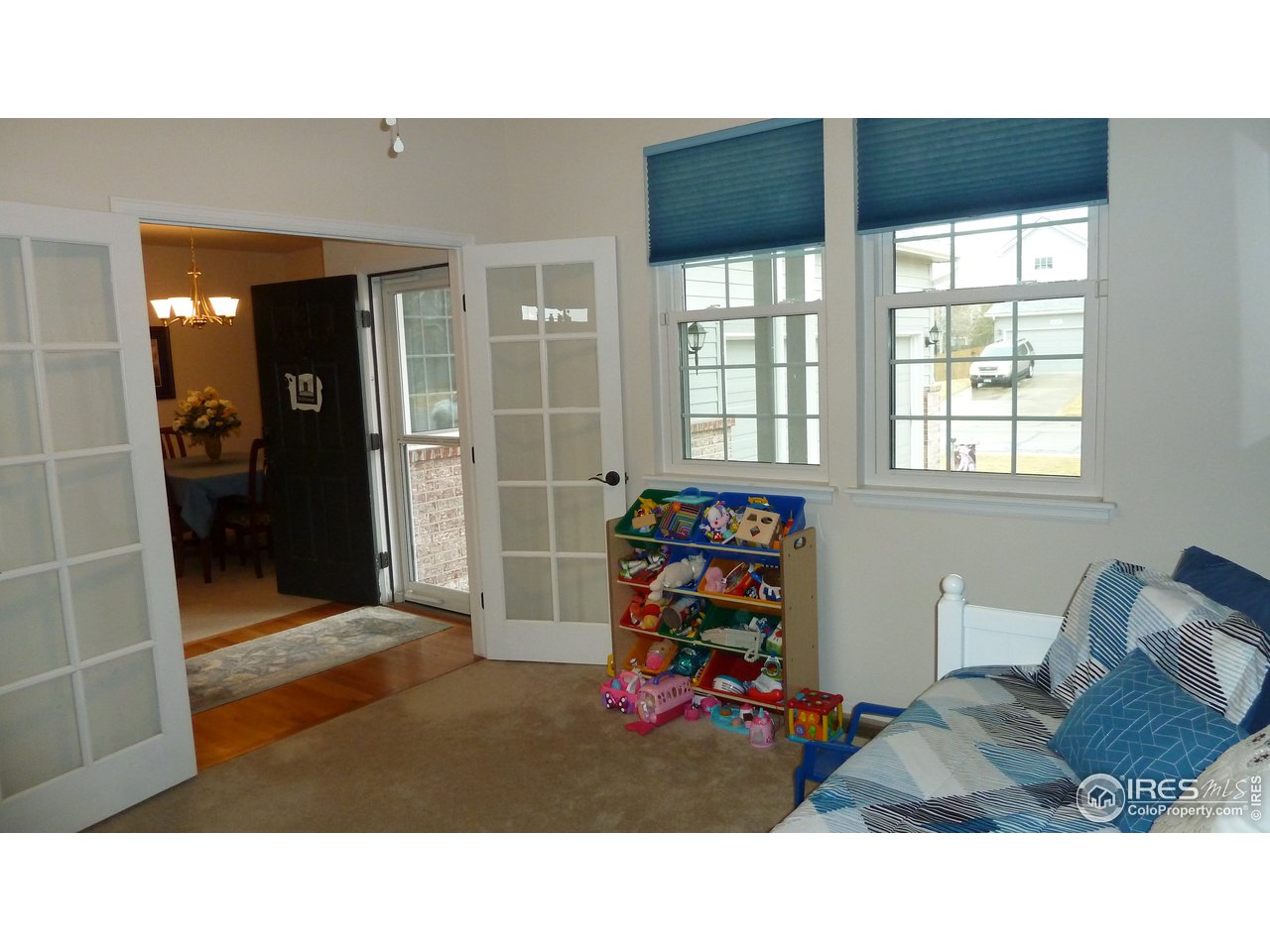 8121 Raspberry Drive Frederick, CO 80504 - Photo 14 of 38 a room with furniture and window