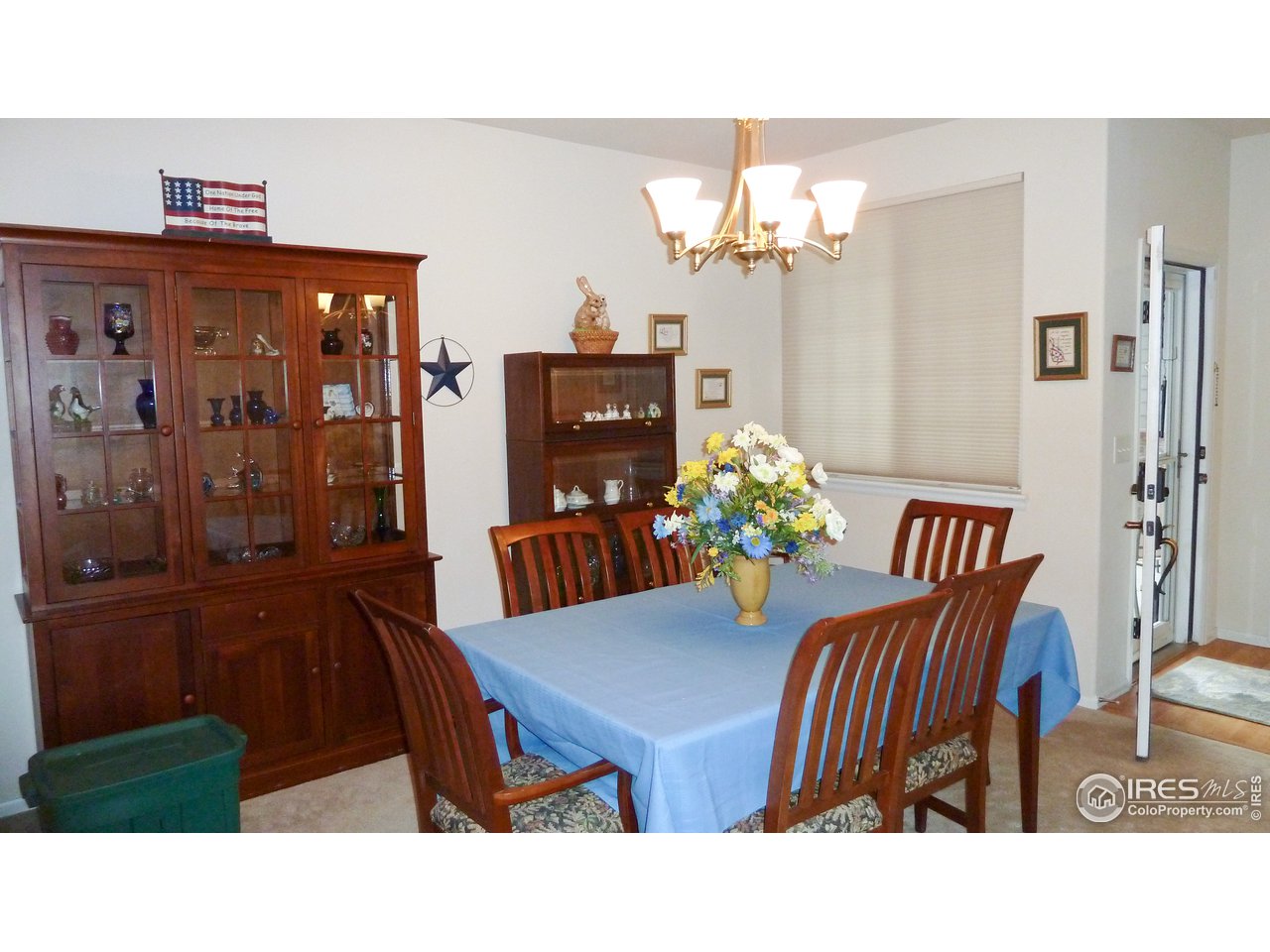 8121 Raspberry Drive Frederick, CO 80504 - Photo 15 of 38 a view of a dining room with furniture and chandelier