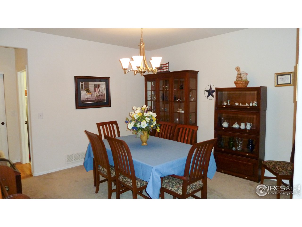 8121 Raspberry Drive Frederick, CO 80504 - Photo 16 of 38 a dining room with furniture and chandelier
