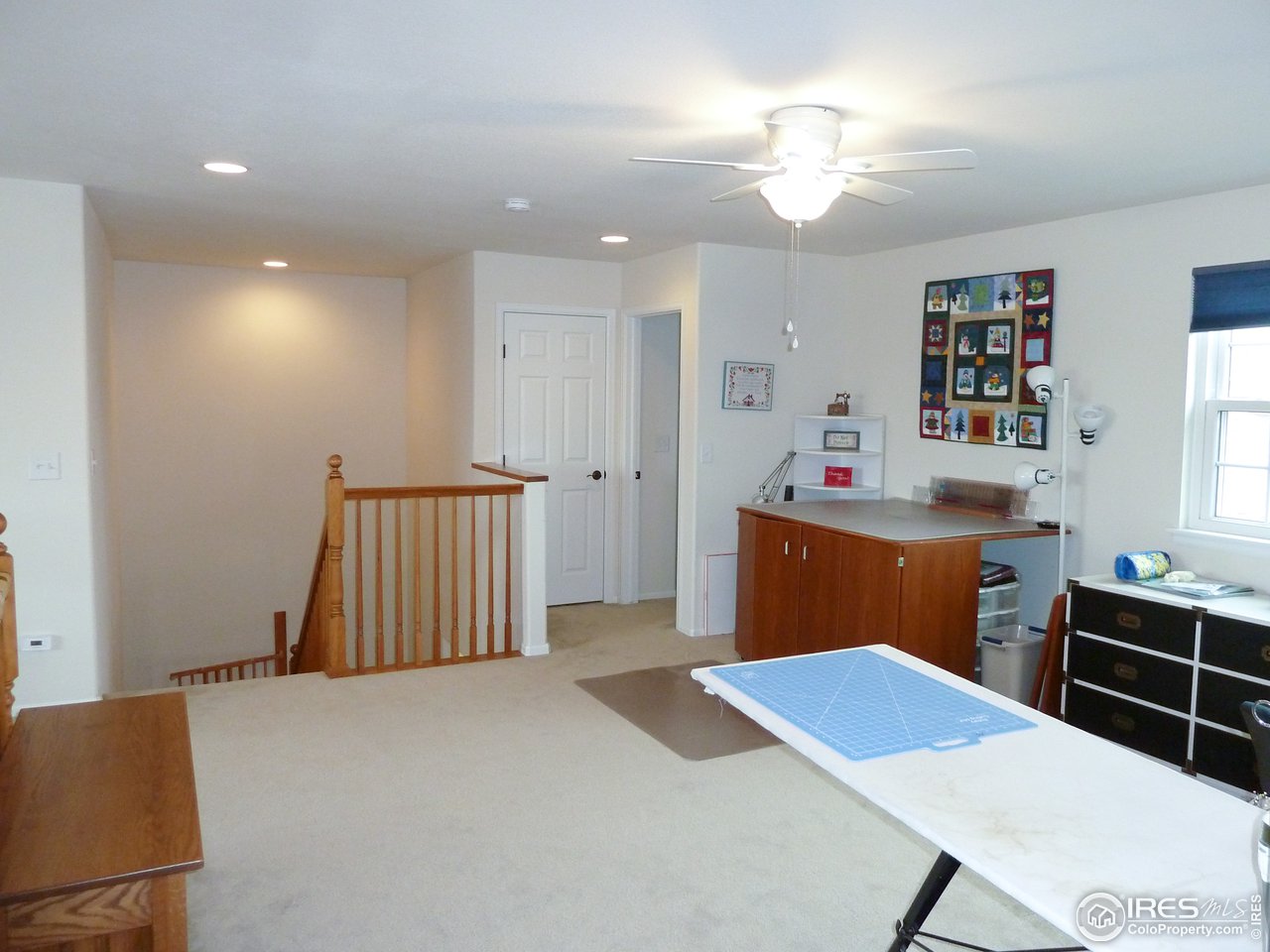 8121 Raspberry Drive Frederick, CO 80504 - Photo 18 of 38 a bedroom with a bed and a dresser