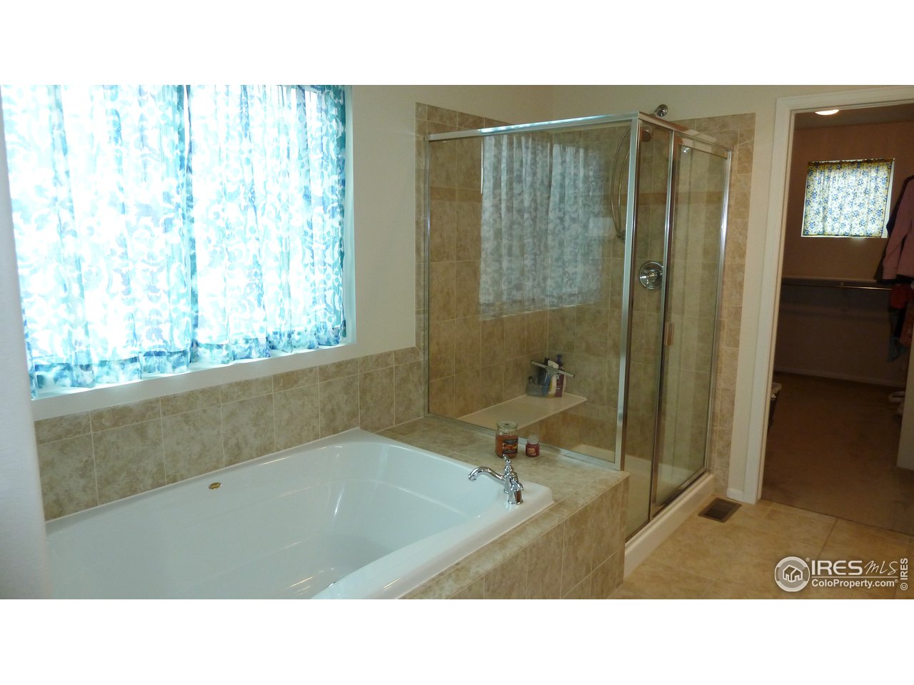 8121 Raspberry Drive Frederick, CO 80504 - Photo 22 of 38 a bathroom with a sink a toilet and shower