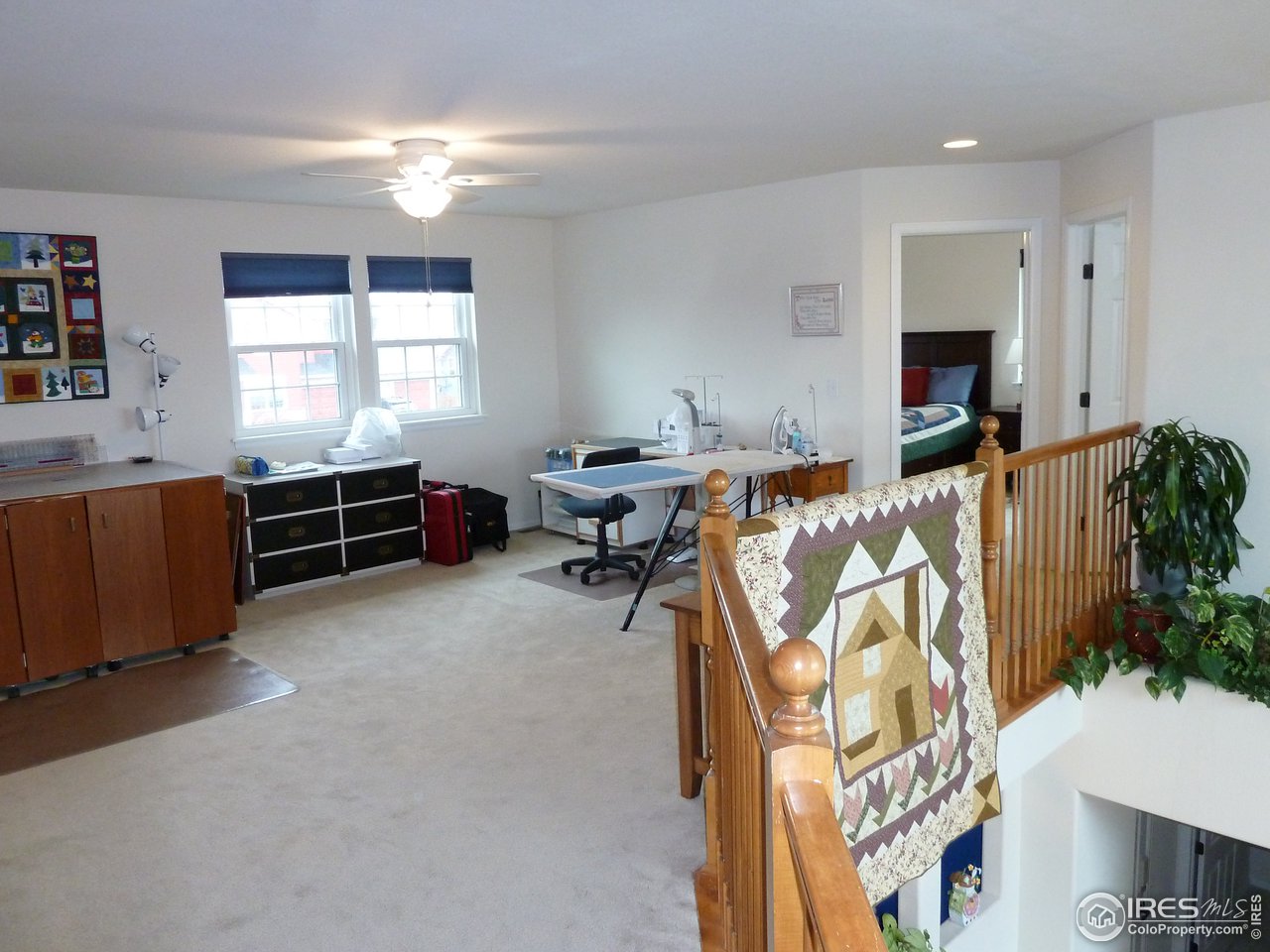 8121 Raspberry Drive Frederick, CO 80504 - Photo 26 of 38 a bed room with furniture and a window