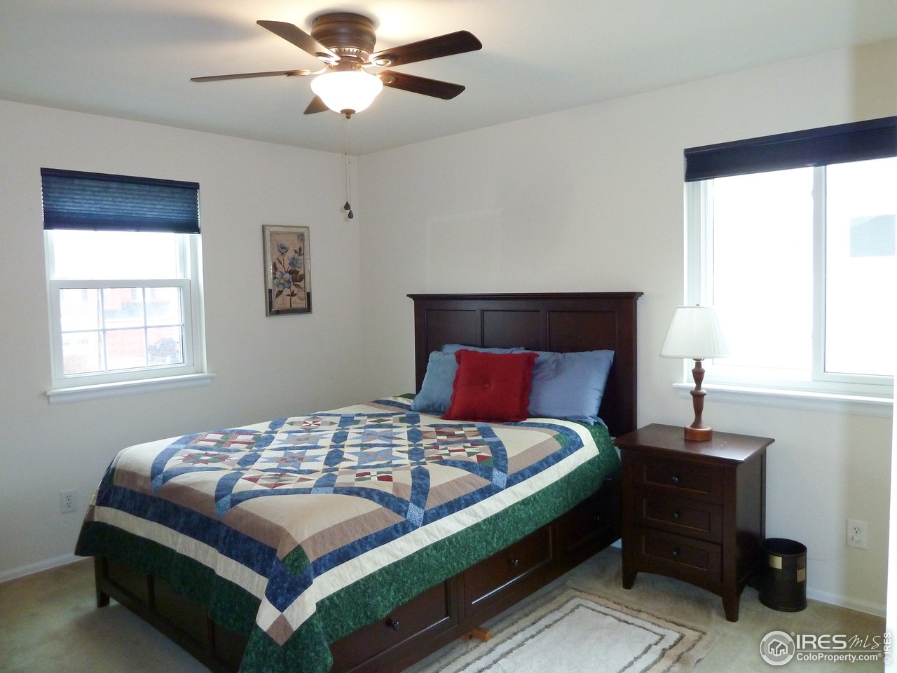 8121 Raspberry Drive Frederick, CO 80504 - Photo 27 of 38 a bedroom with a bed and window