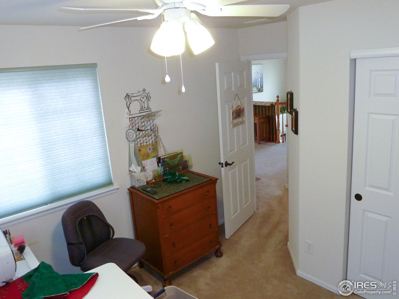 8121 Raspberry Drive Frederick, CO 80504 - Photo 31 of 38 a living room with furniture and a chandelier
