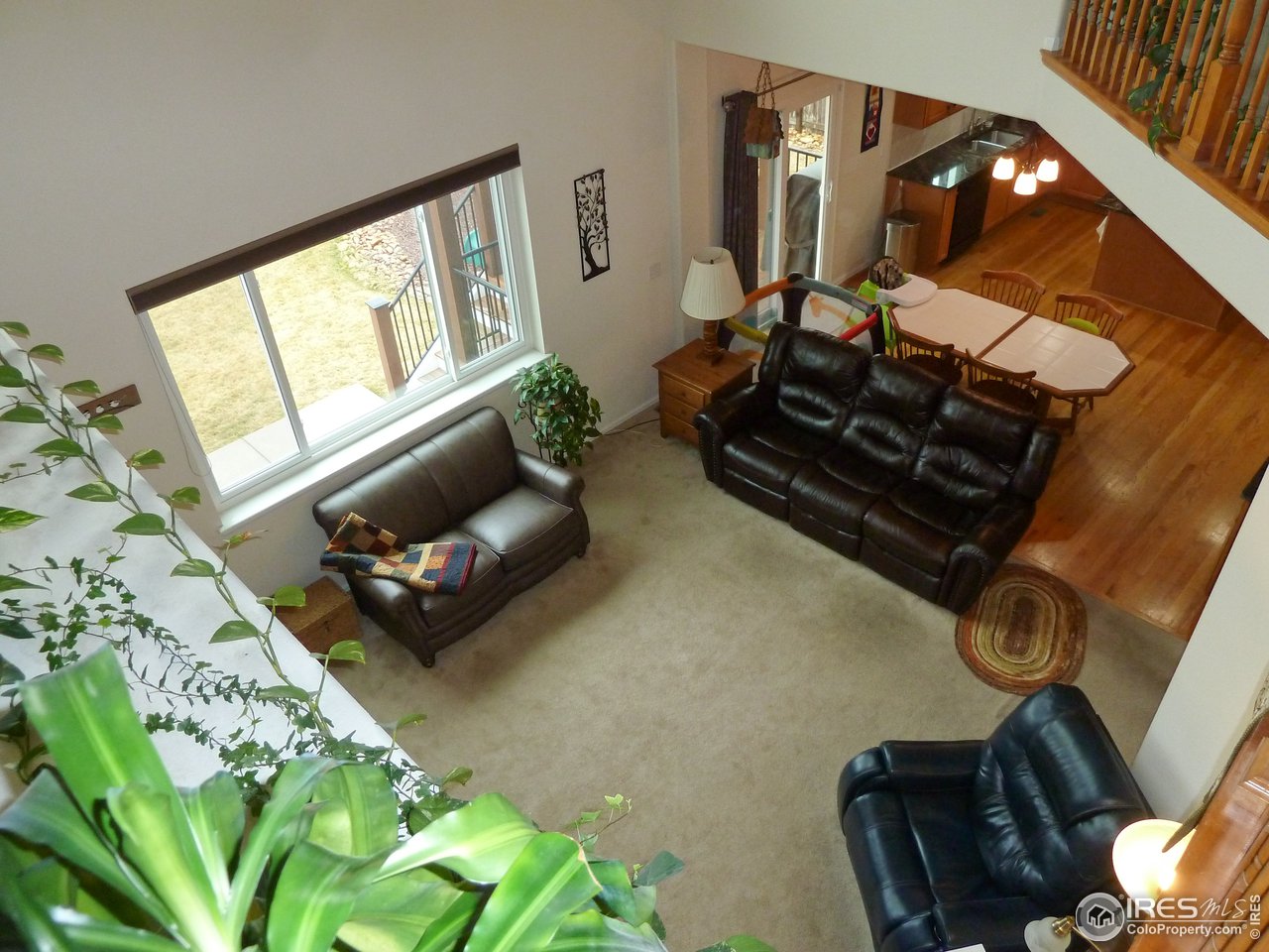8121 Raspberry Drive Frederick, CO 80504 - Photo 8 of 38 a living room with furniture and a mirror