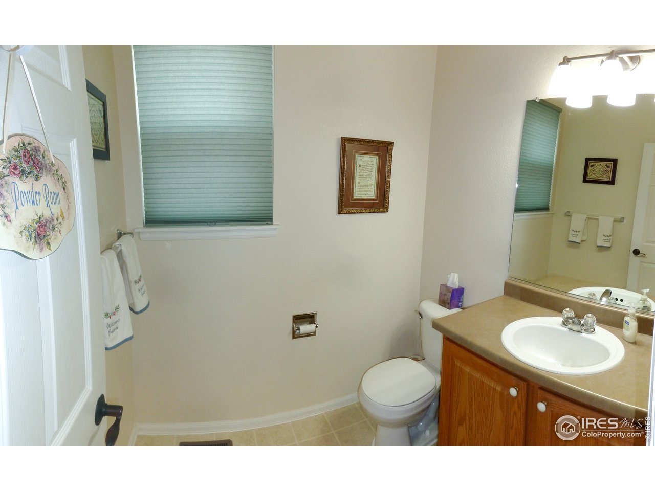 8121 Raspberry Drive Frederick, CO 80504 - Photo 10 of 38 a bathroom with a granite countertop sink toilet a mirror and shower