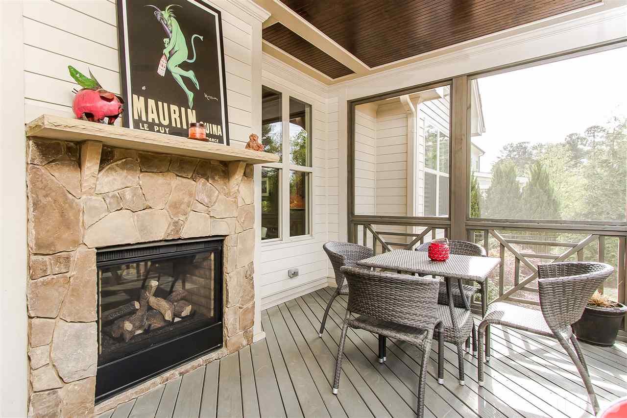 2804 Romealia Lane Raleigh, NC 27613 - Photo 11 of 25 a living room with furniture and a fireplace
