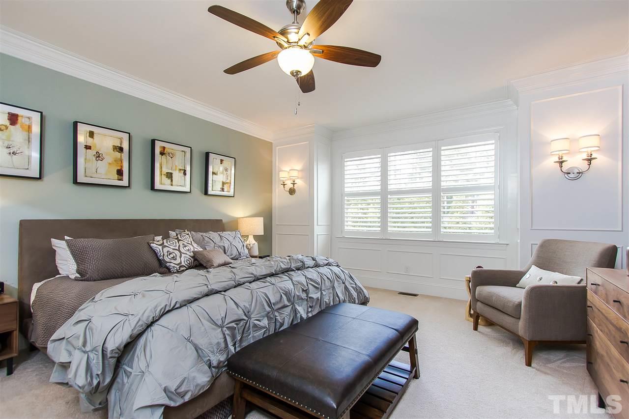 2804 Romealia Lane Raleigh, NC 27613 - Photo 12 of 25 a bedroom with a bed and a couch