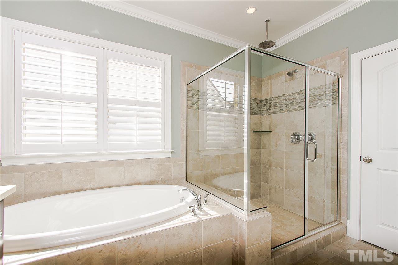 2804 Romealia Lane Raleigh, NC 27613 - Photo 14 of 25 a bathroom with a bathtub and shower
