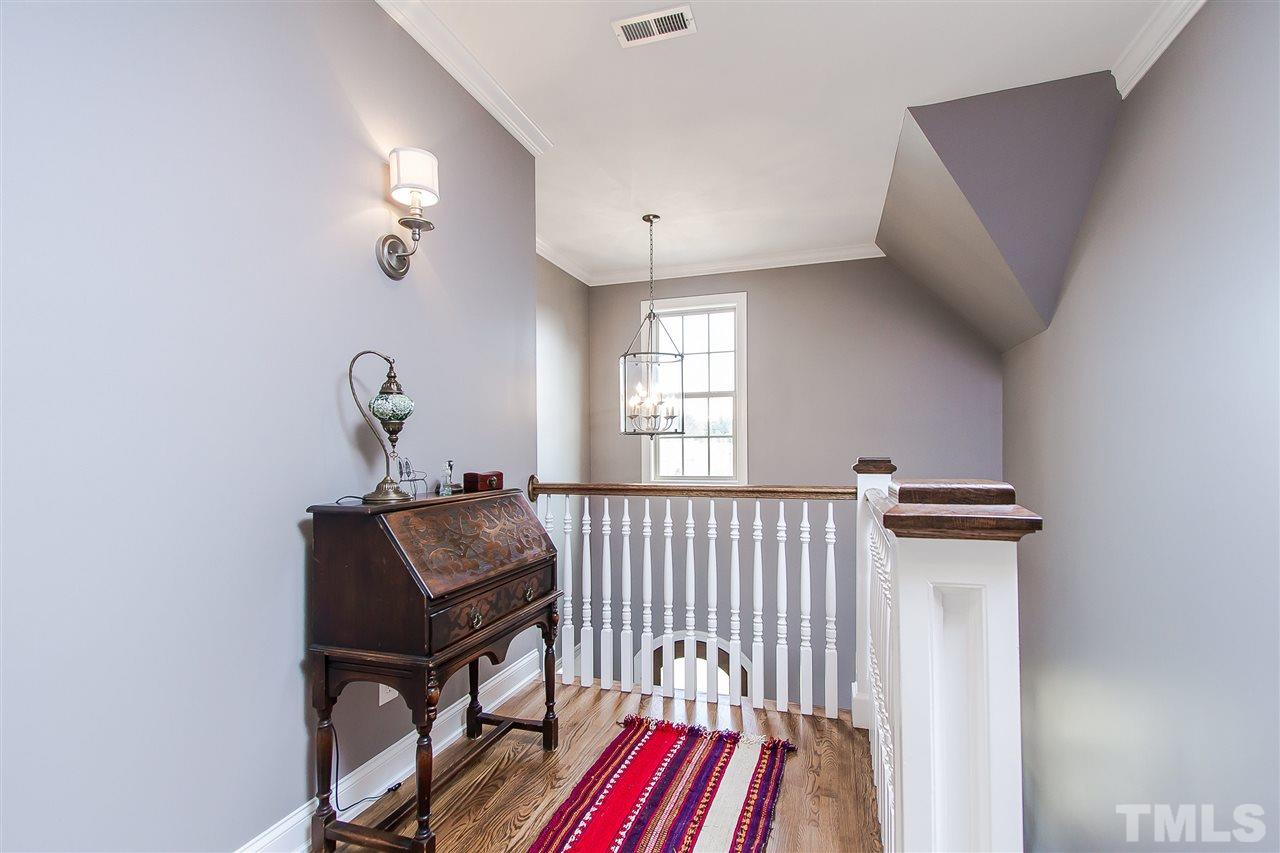 2804 Romealia Lane Raleigh, NC 27613 - Photo 16 of 25 a bedroom with furniture and a window