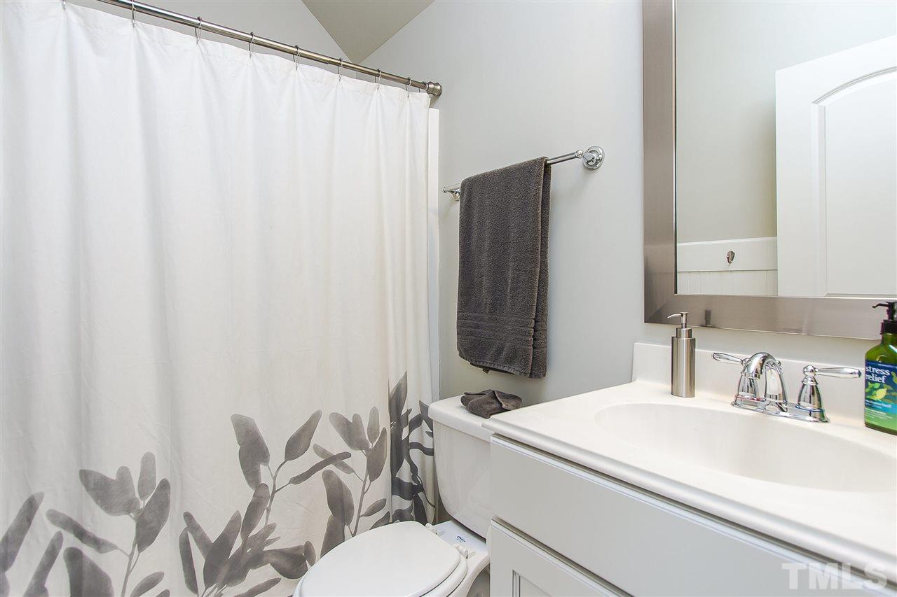 2804 Romealia Lane Raleigh, NC 27613 - Photo 18 of 25 a bathroom with a sink toilet and shower