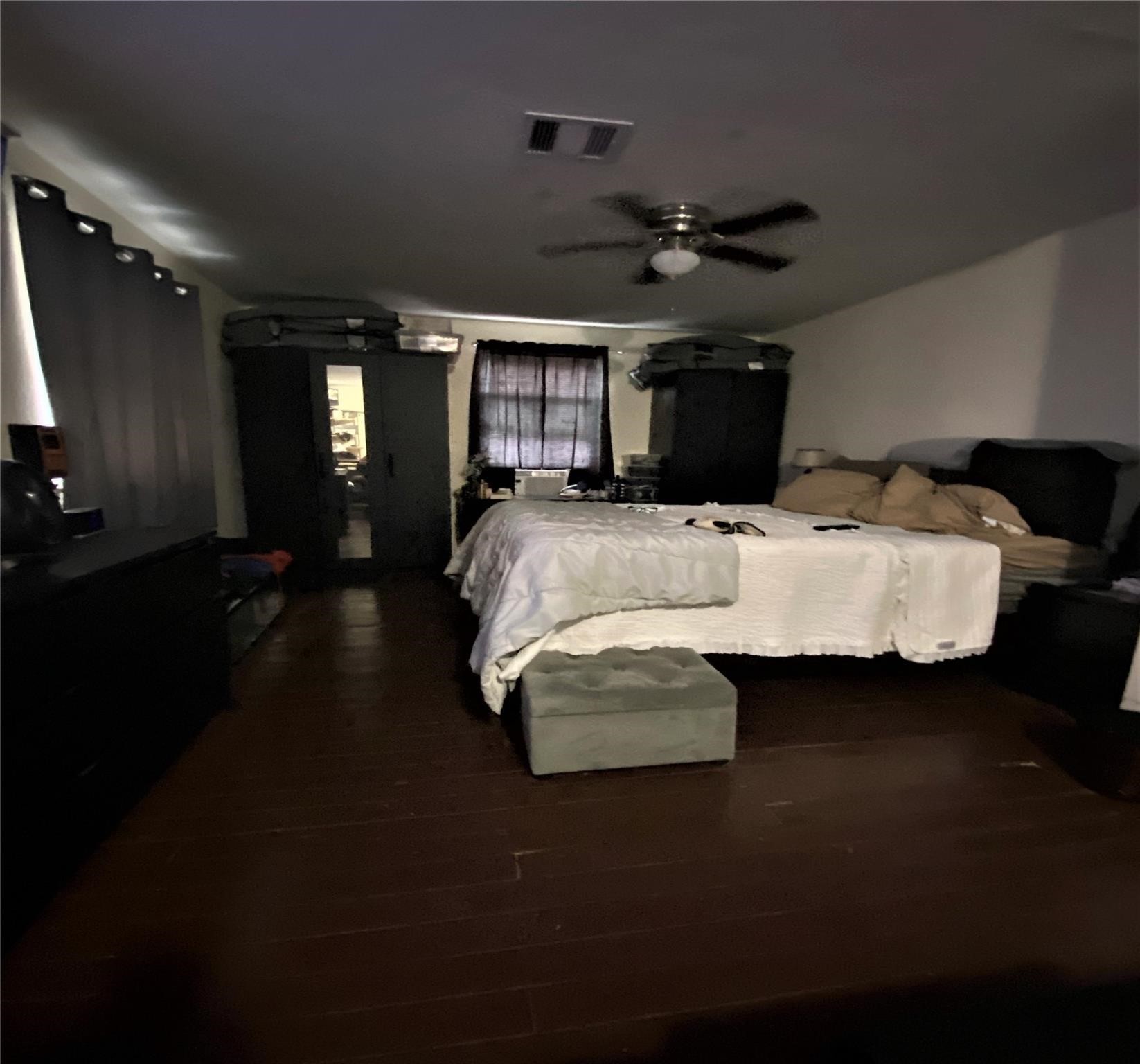 4802 Ward Street Houston, TX 77021 - Photo 4 of 16 a bed room with furniture and wooden floor
