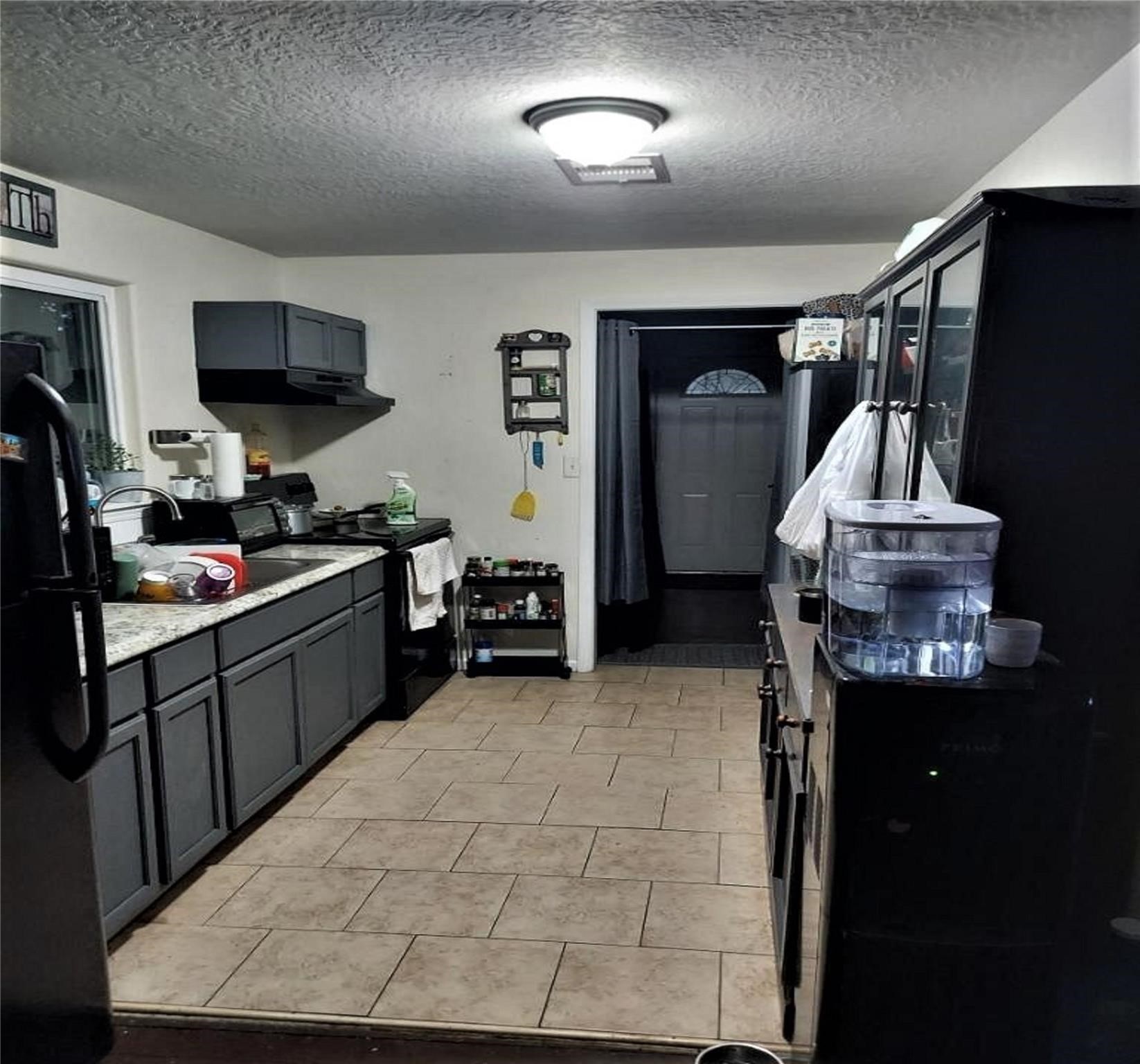 4802 Ward Street Houston, TX 77021 - Photo 6 of 16 a kitchen that has a sink and a stove in it