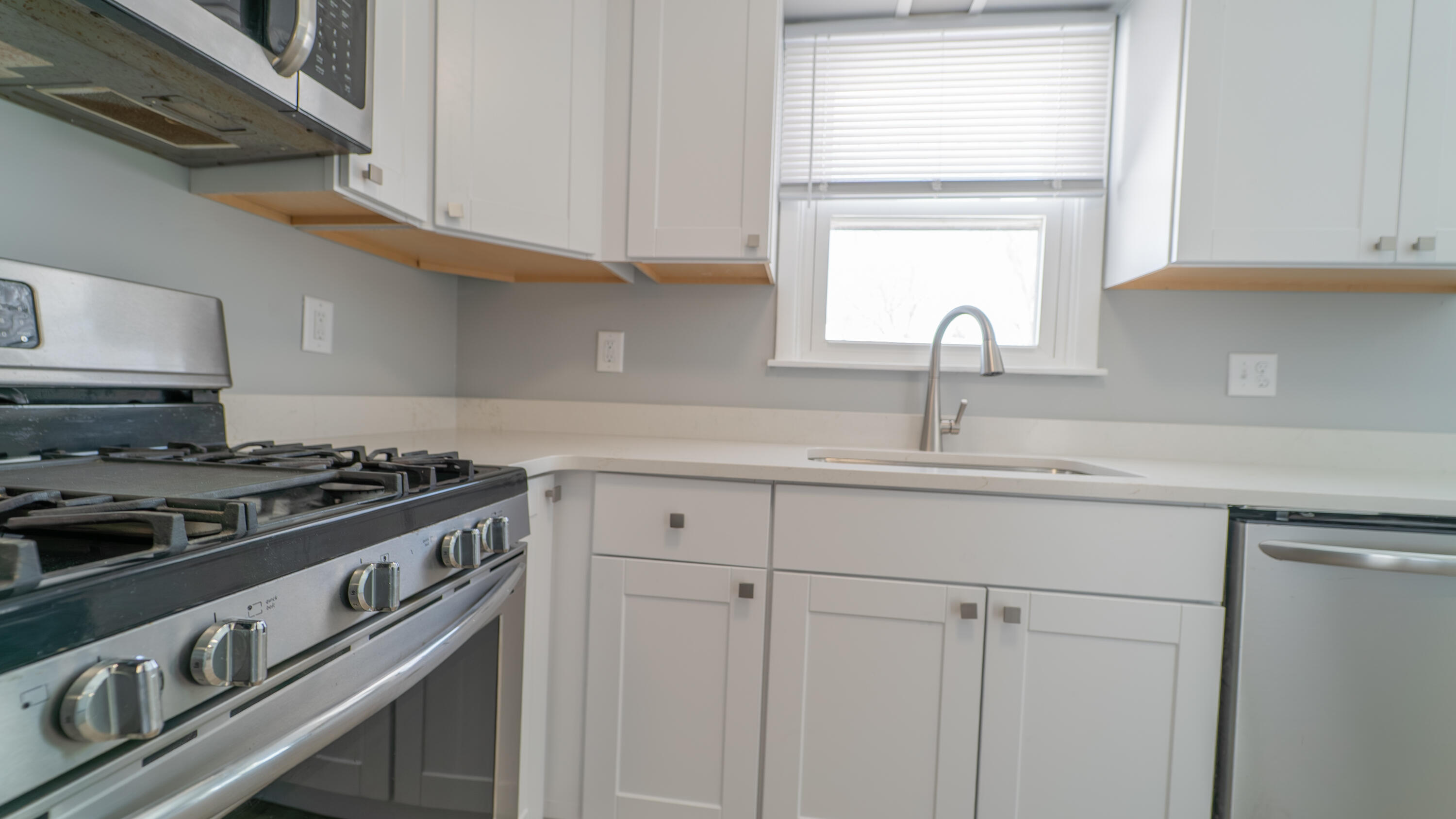 9380 Mckinley Street Crown Point, IN 46307 - Photo 13 of 41 a kitchen with a stove and a sink