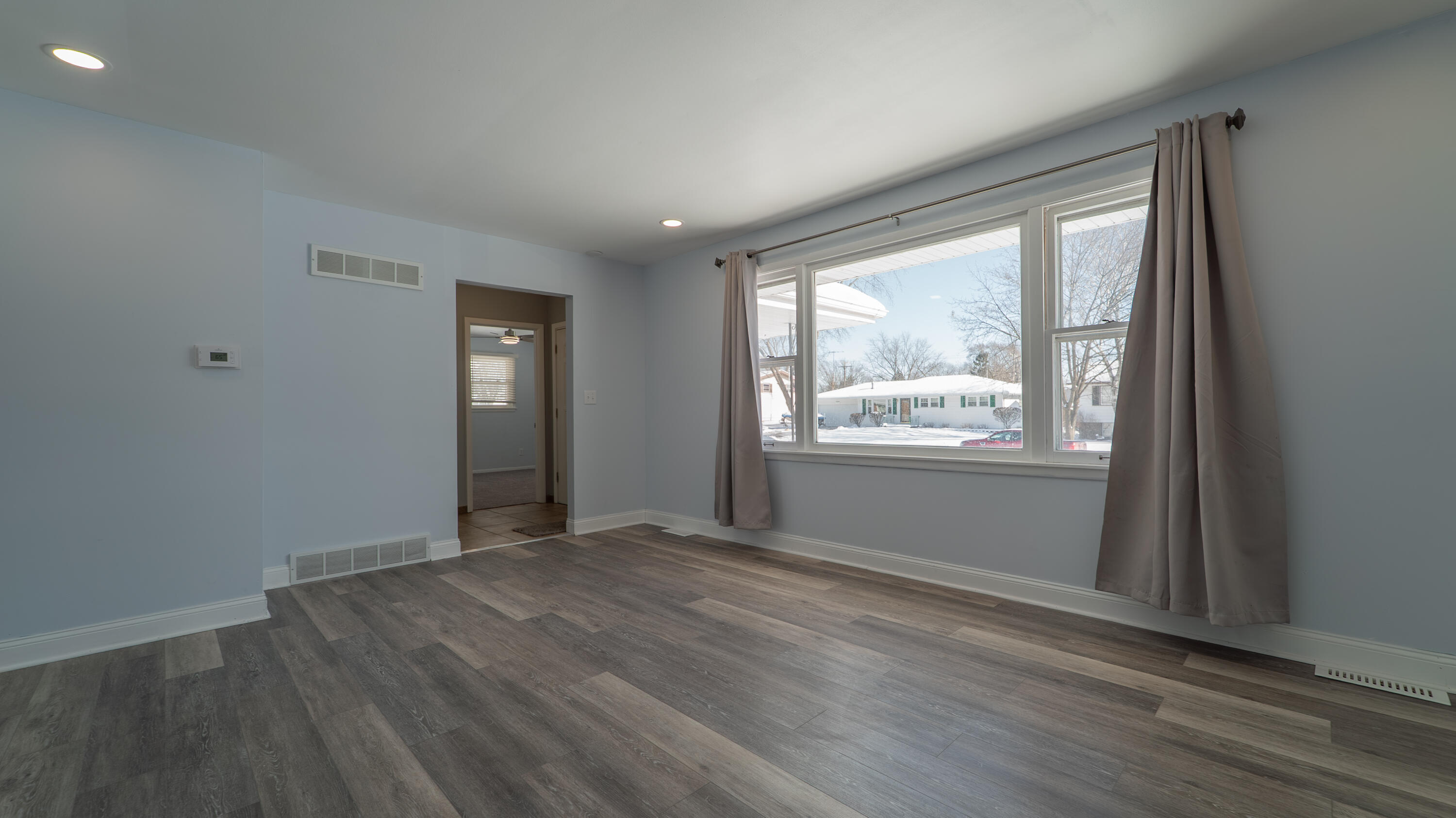 9380 Mckinley Street Crown Point, IN 46307 - Photo 19 of 41 an empty room with wooden floor and windows