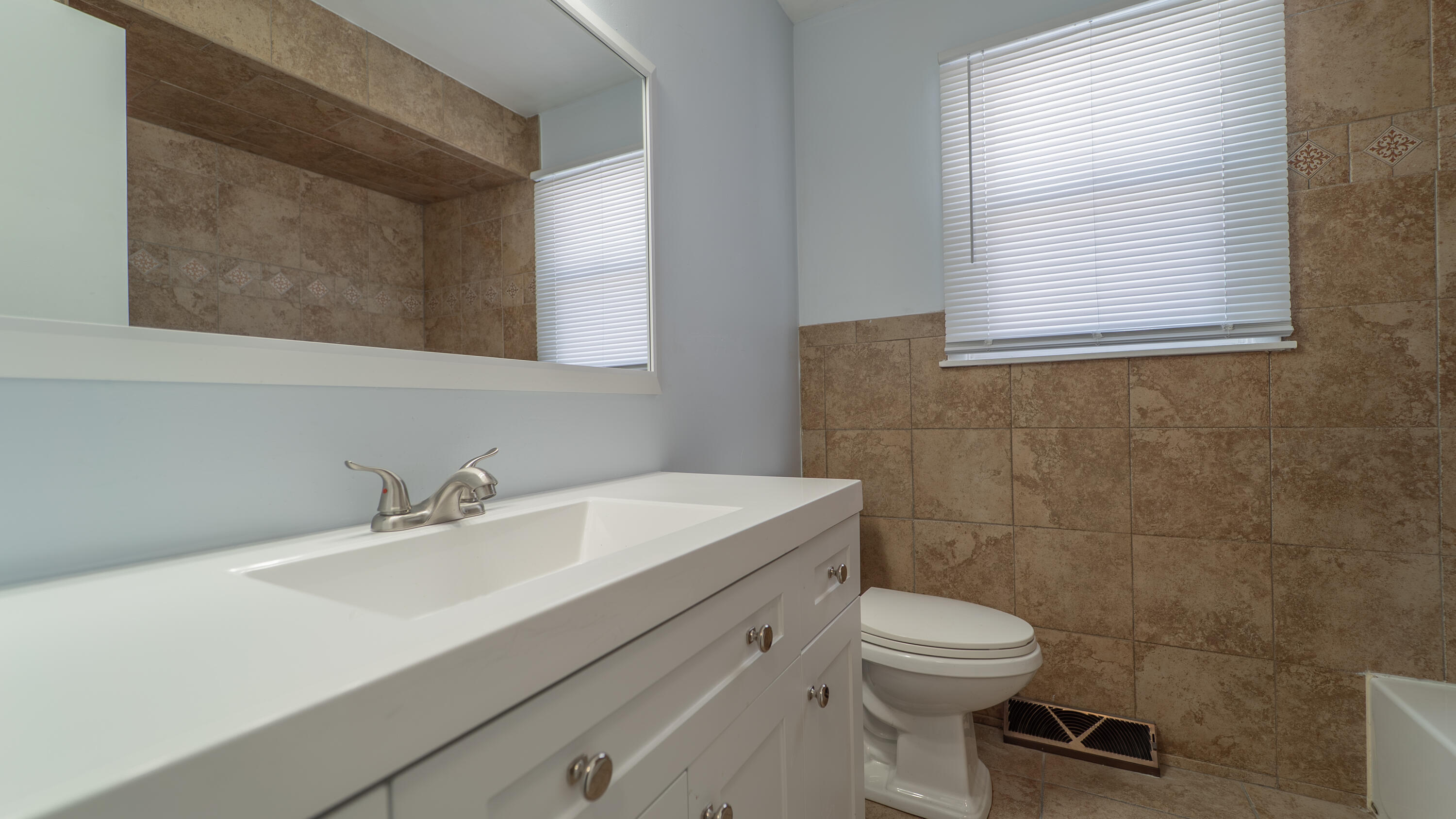 9380 Mckinley Street Crown Point, IN 46307 - Photo 22 of 41 a bathroom with a sink a toilet and a mirror