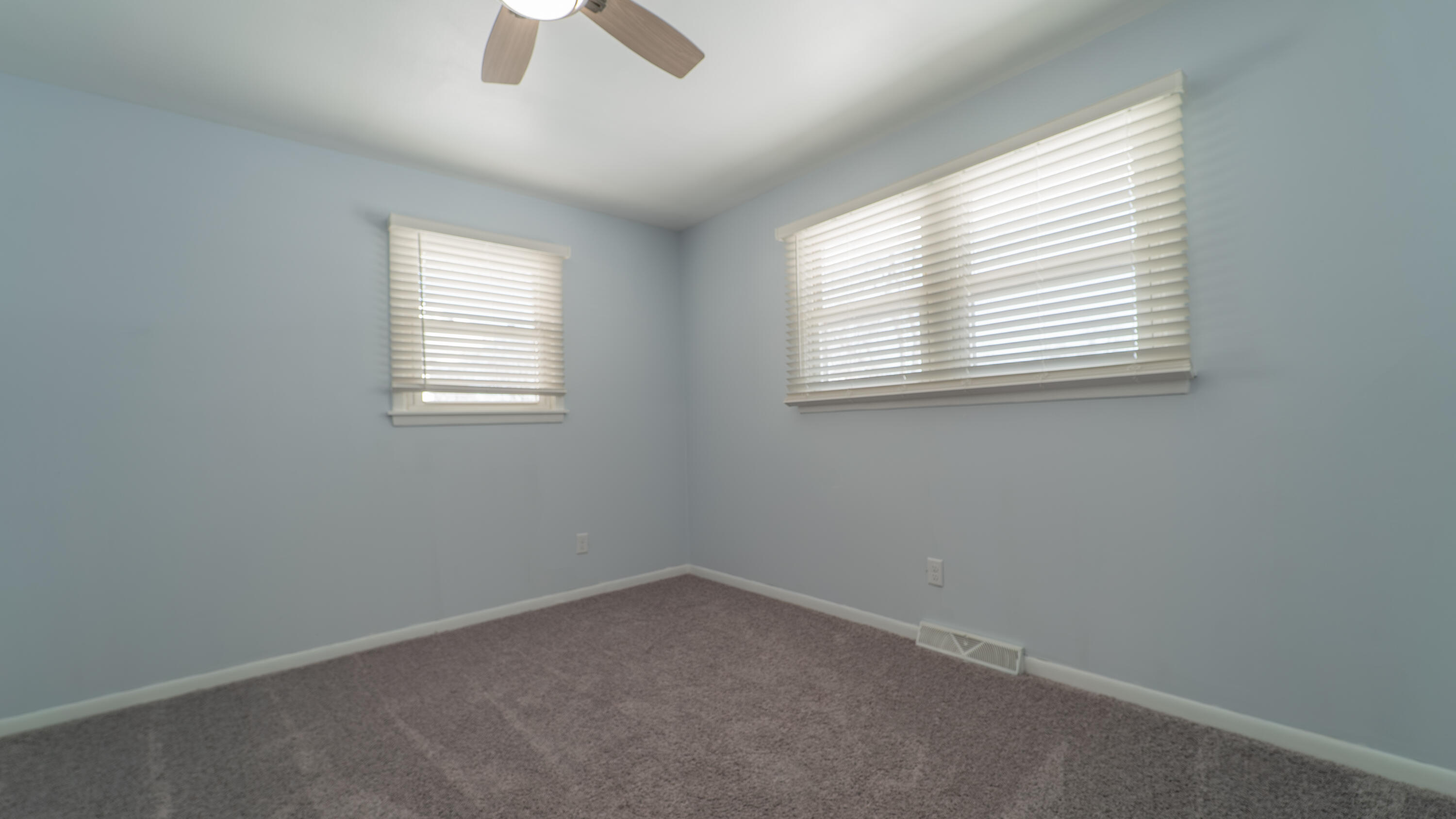 9380 Mckinley Street Crown Point, IN 46307 - Photo 25 of 41 an empty room with a window and a fan