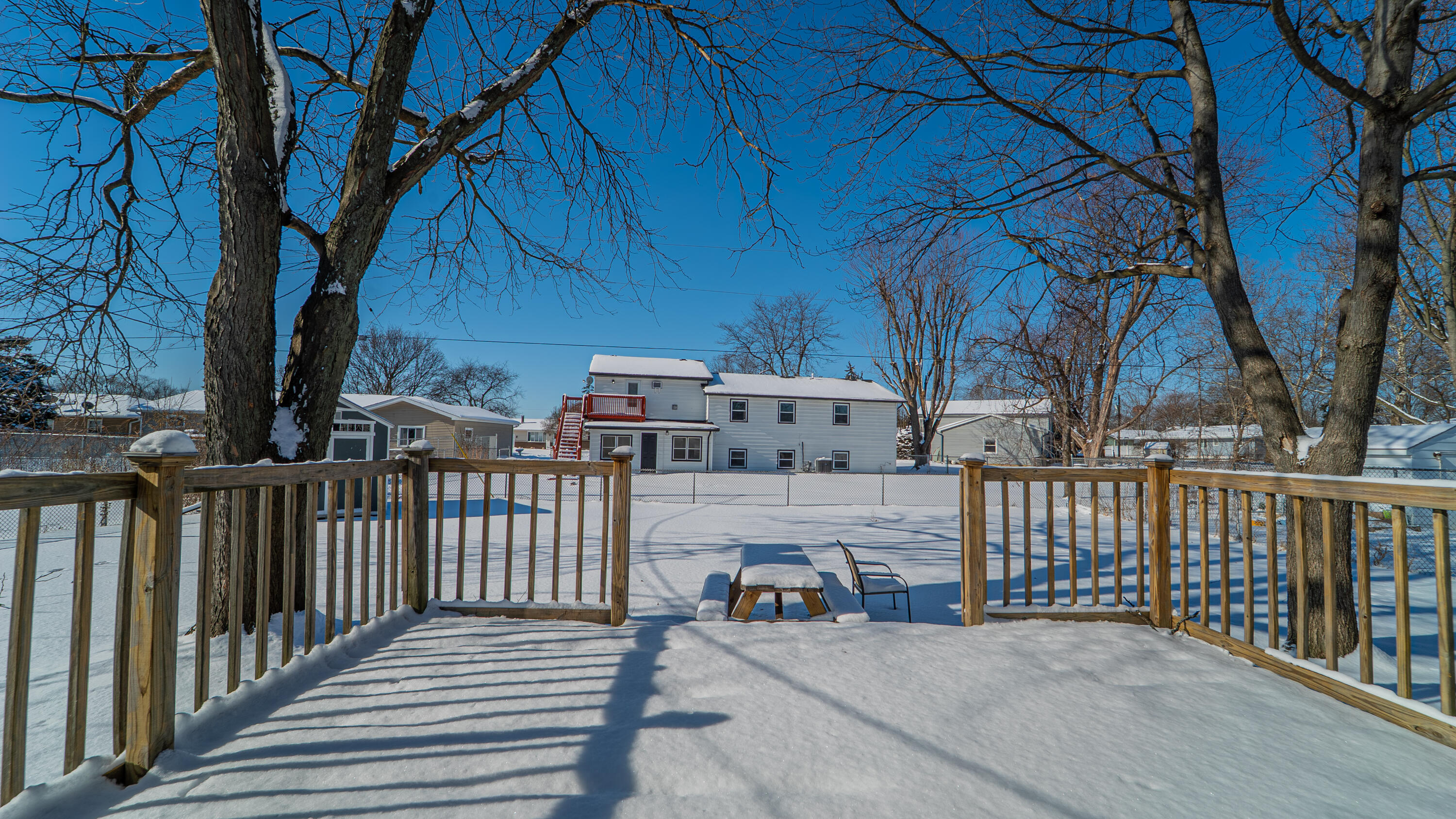 9380 Mckinley Street Crown Point, IN 46307 - Photo 5 of 41 a view of a porch with furniture and trees