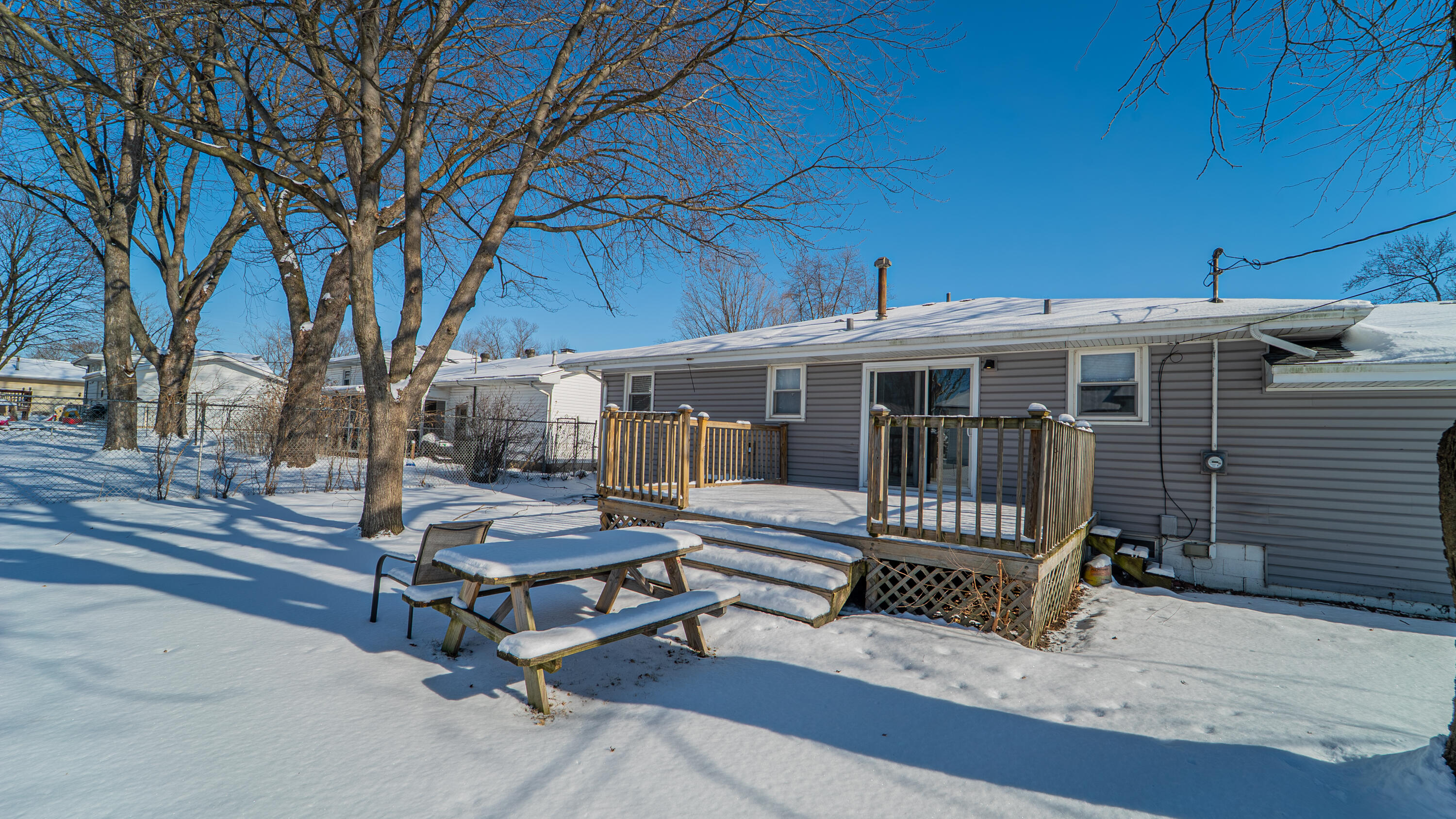 9380 Mckinley Street Crown Point, IN 46307 - Photo 7 of 41 a view of a patio with a table and chairs
