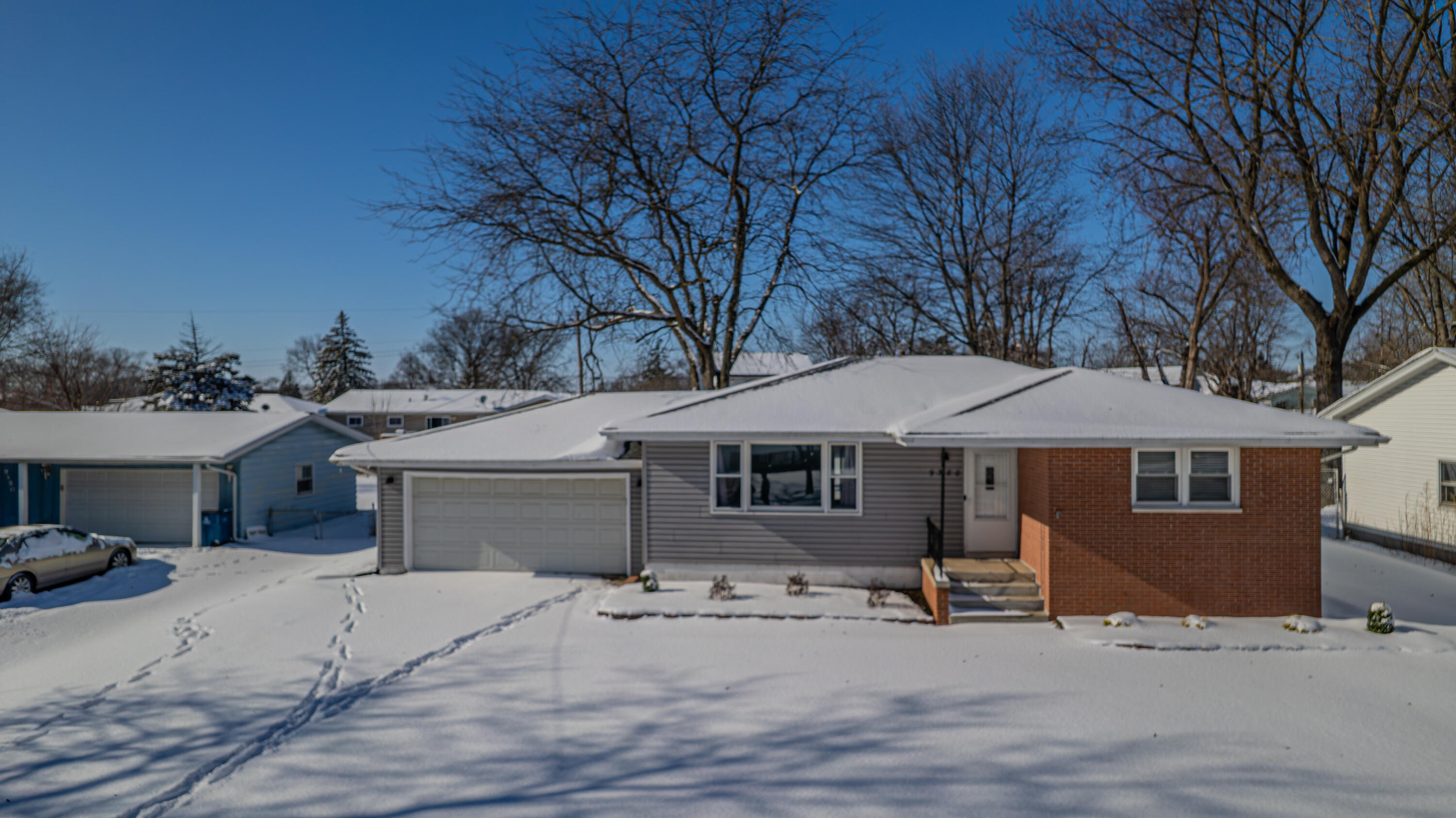 9380 Mckinley Street Crown Point, IN 46307 - Photo 8 of 41 a front view of a house with a garage