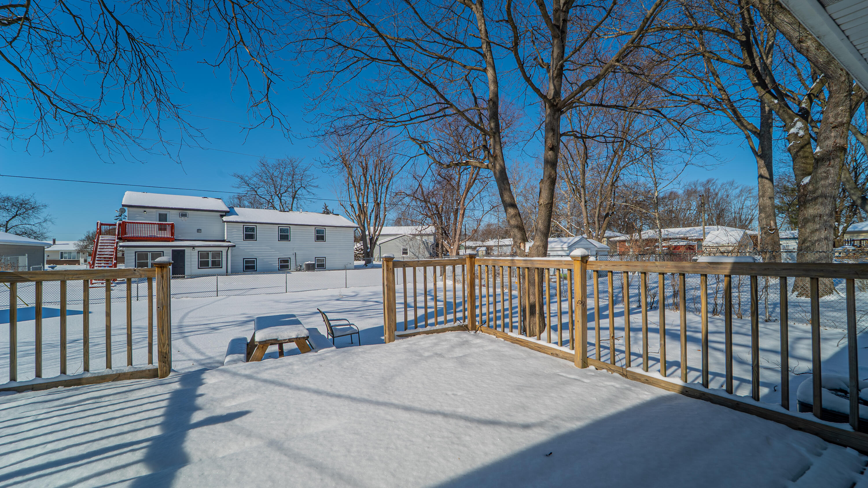 9380 Mckinley Street Crown Point, IN 46307 - Photo 9 of 41 a view of a terrace with wooden fence