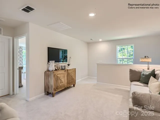 a bed room with a bed and a painting