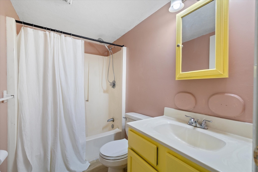 310 Codman Hill Road, Unit 35D Boxborough, MA 01719 - Photo 5 of 9 a bathroom with a sink toilet and shower
