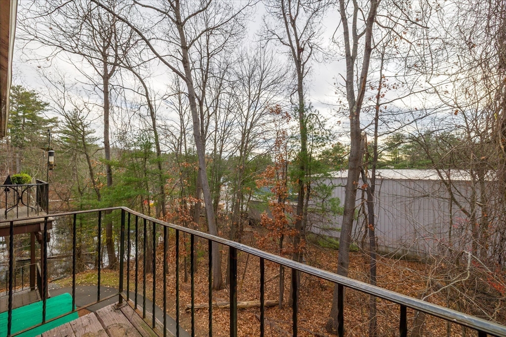 310 Codman Hill Road, Unit 35D Boxborough, MA 01719 - Photo 6 of 9 a view of a balcony with trees