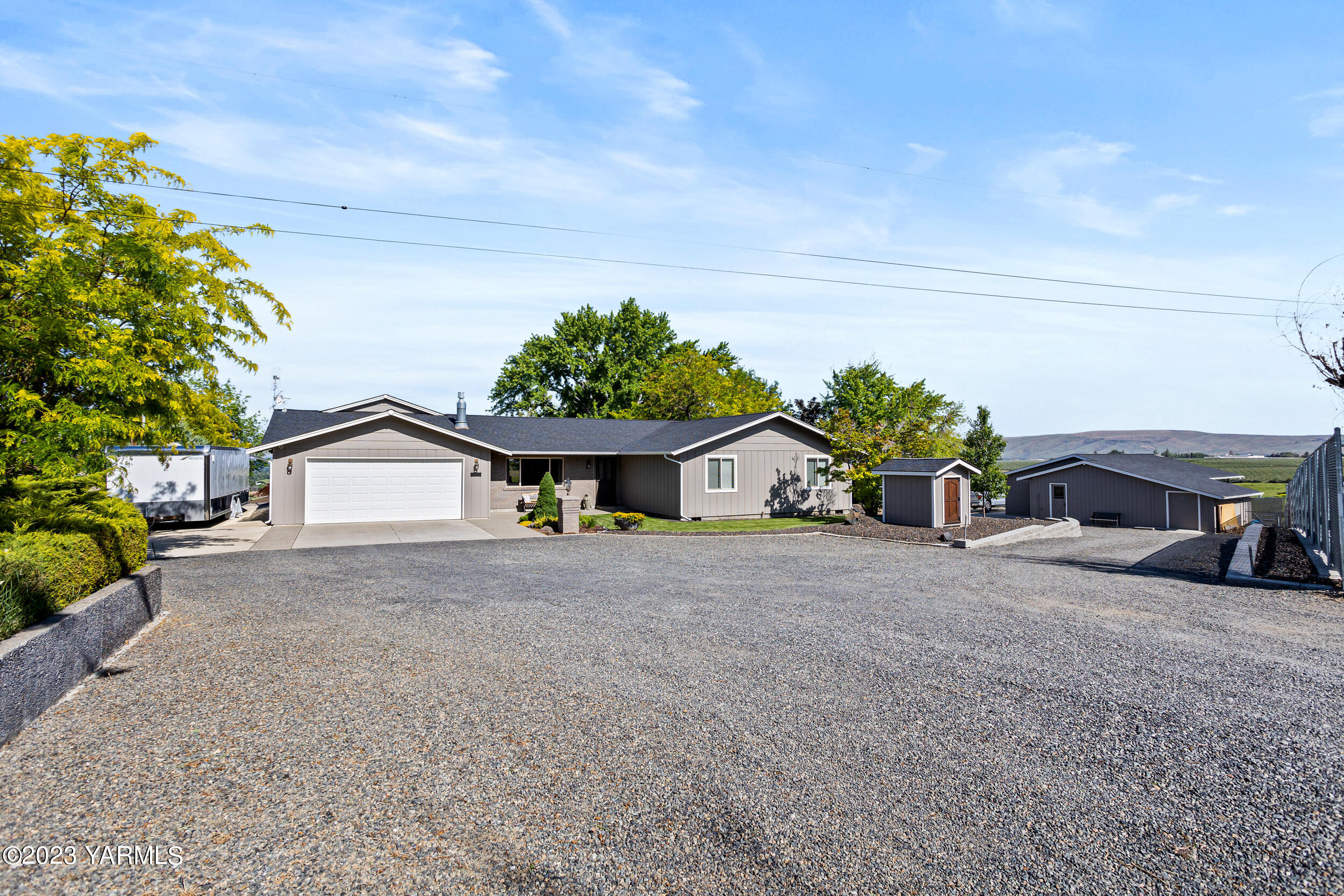 a view of a house with a yard and garage