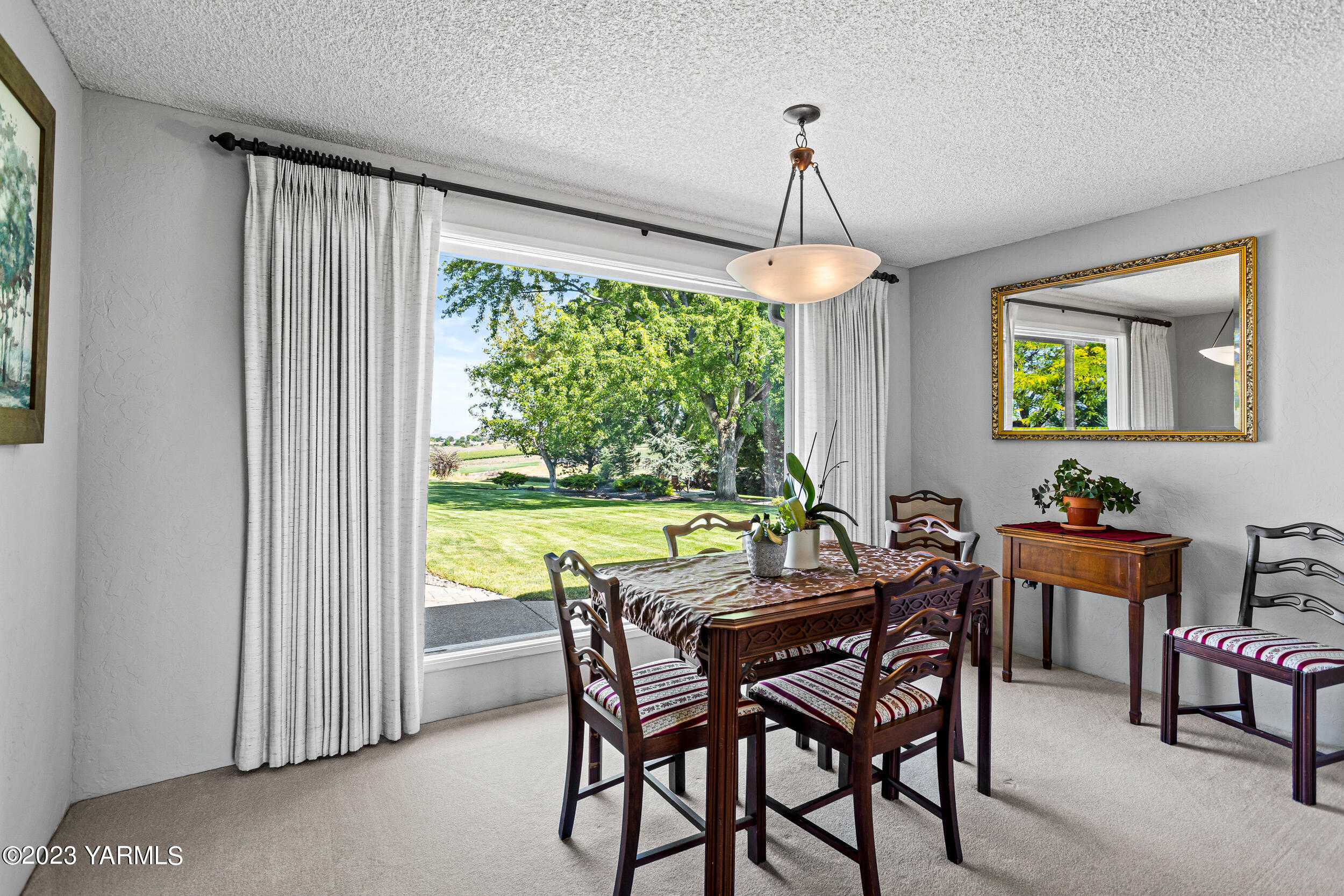 13518 Fisk Road Yakima, WA 98908 - Photo 11 of 58 a view of a dining room with furniture window and outside view