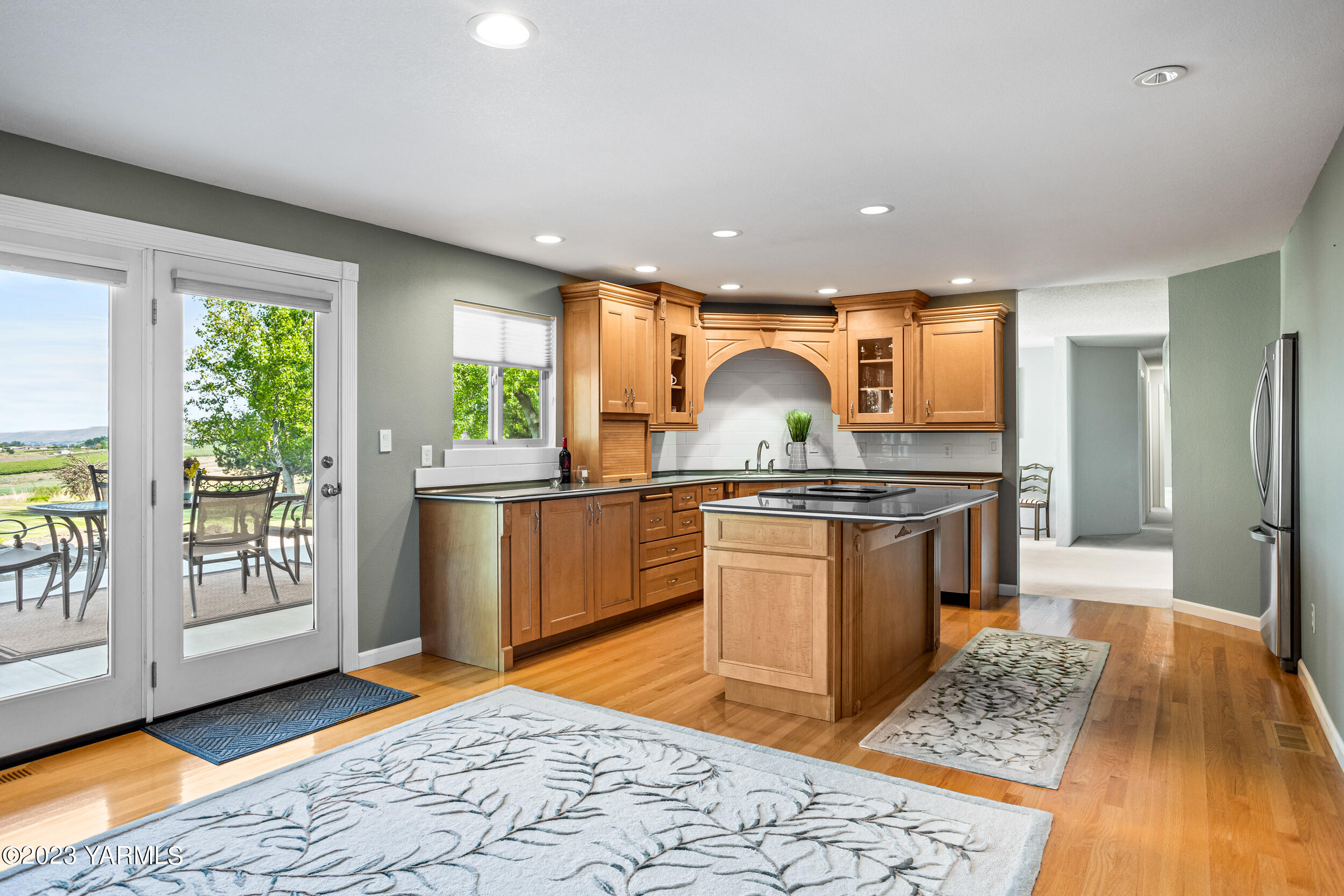 13518 Fisk Road Yakima, WA 98908 - Photo 12 of 58 a kitchen with stainless steel appliances granite countertop a sink and a stove top oven