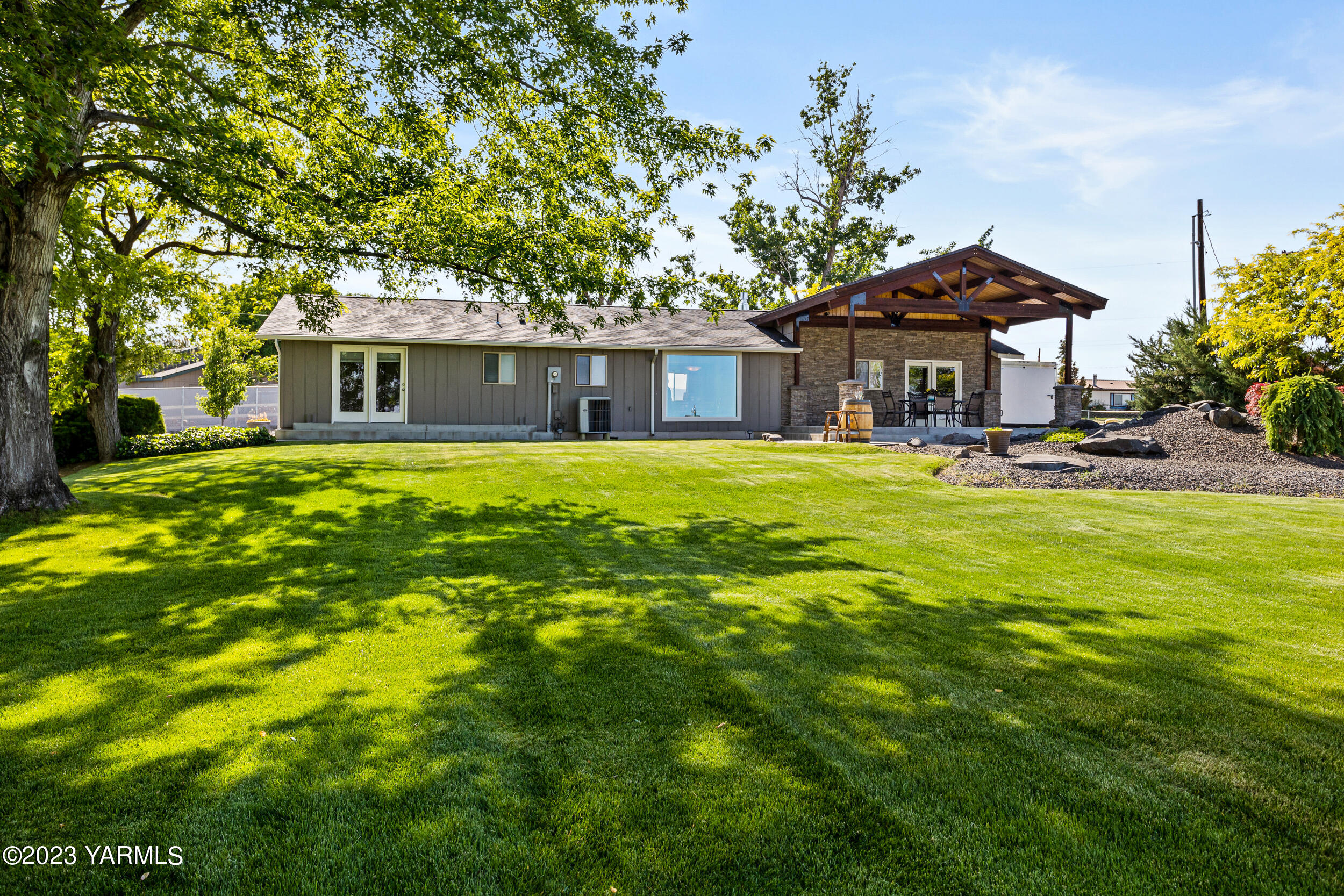 13518 Fisk Road Yakima, WA 98908 - Photo 38 of 58 a view of a house with a yard and tree s