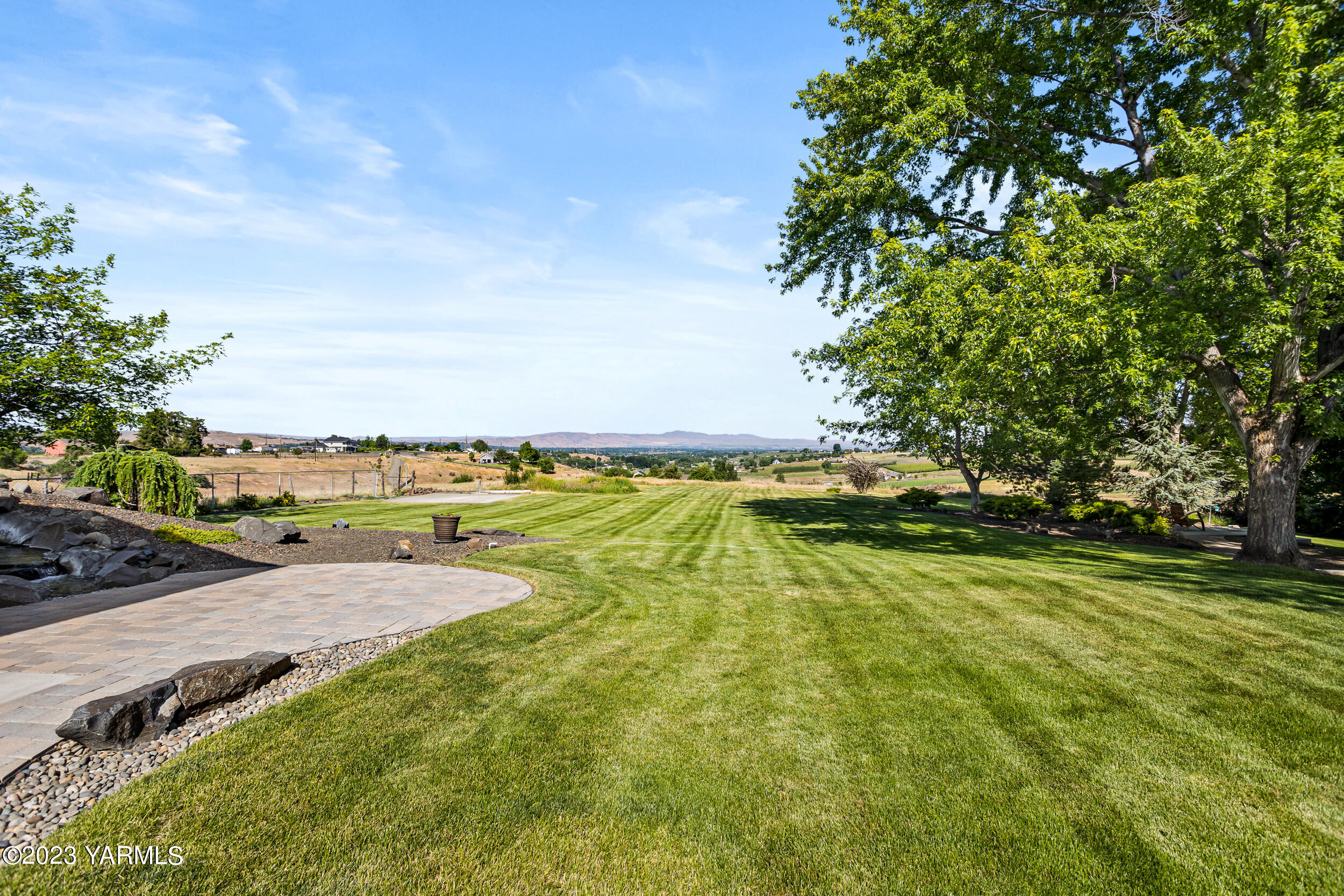 13518 Fisk Road Yakima, WA 98908 - Photo 47 of 58 a view of a swimming pool with an outdoor seating and a yard