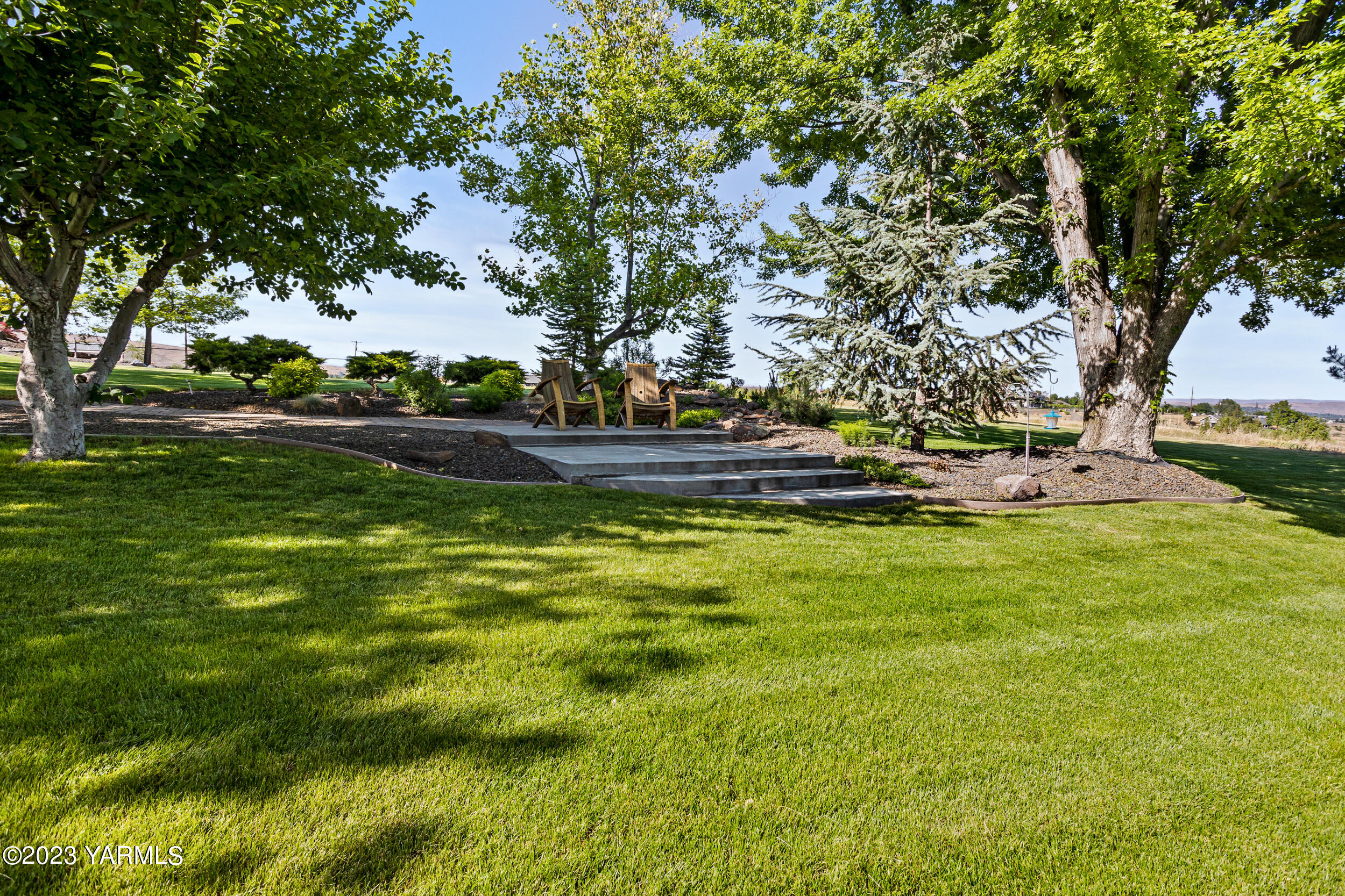 13518 Fisk Road Yakima, WA 98908 - Photo 52 of 58 a view of a swimming pool with a yard