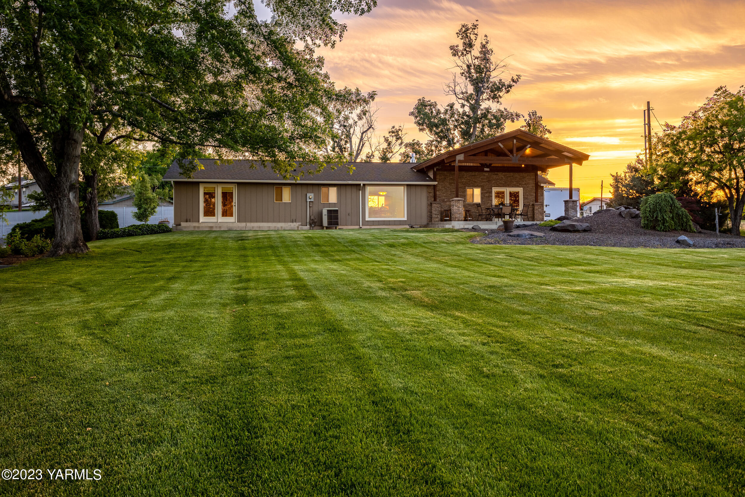13518 Fisk Road Yakima, WA 98908 - Photo 55 of 58 a view of a yard in front of a house with large trees