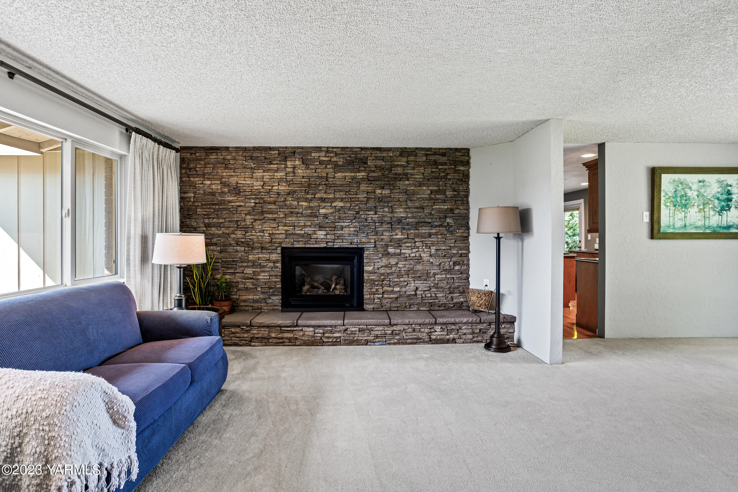 13518 Fisk Road Yakima, WA 98908 - Photo 6 of 58 a living room with furniture and a fireplace